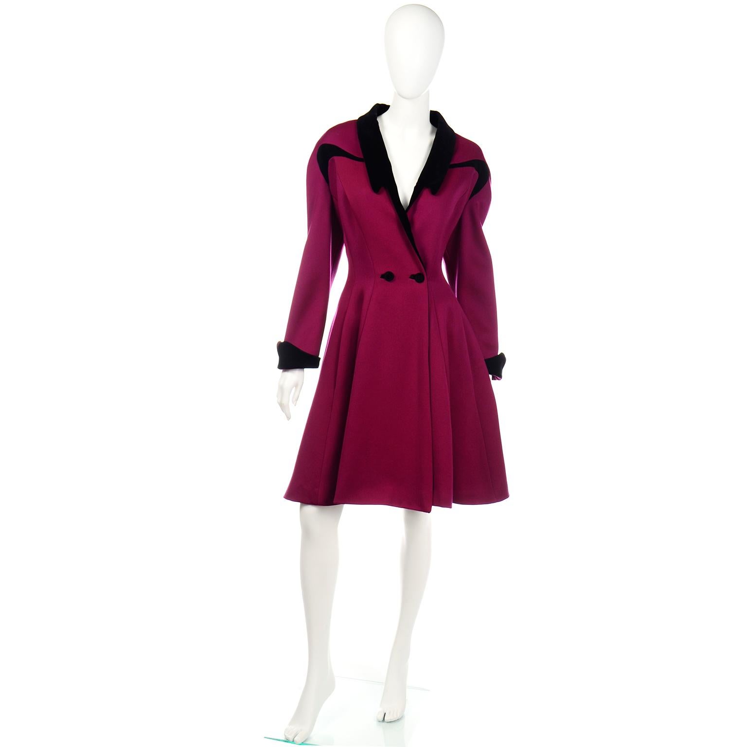 This vintage magenta Thierry Mugler coat is one of our favorites!  We love the way it moves and the flattering princess style silhouette. The rich shade of magenta fabric is a wool and angora blend.  The coat is trimmed in black cotton velvet with