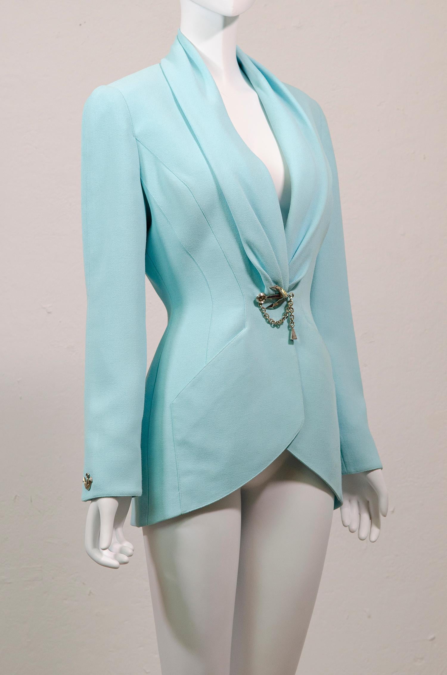Amazing vintage Thierry Mugler pastel blue jacket with nautical silver anchor details.

Thierry Mugler often revisited aquatic themes through out his collections, often featuring fin details on lapels and pockets, and of course most notably in his