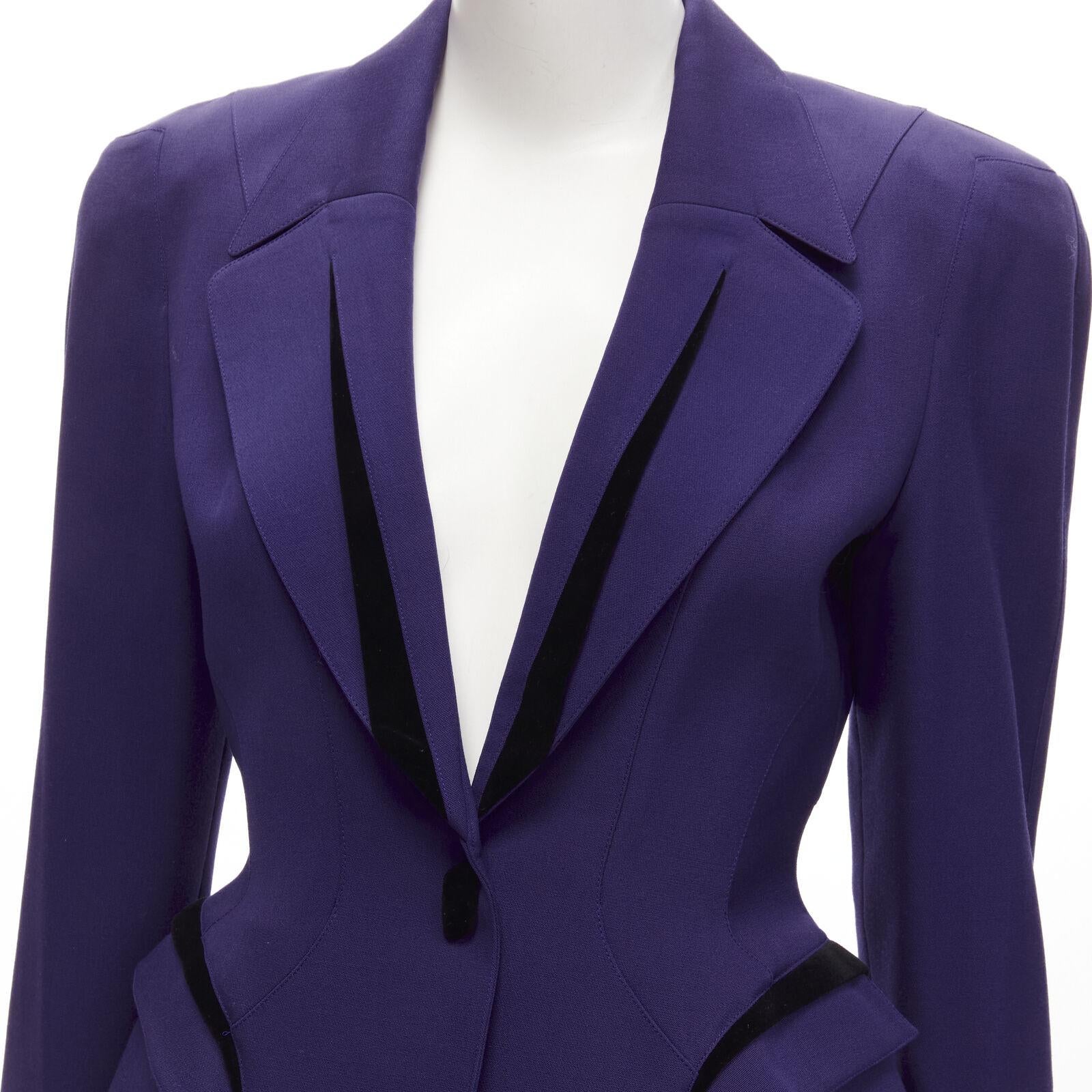 THIERRY MUGLER Vintage purple space age velvet peplum power blazer IT9AR S
Reference: TGAS/C01612
Brand: Thierry Mugler
Designer: Thierry Mugler
Collection: 1980s
Material: 100% Wool
Color: Purple
Pattern: Solid
Closure: Snap Buttons
Lining: