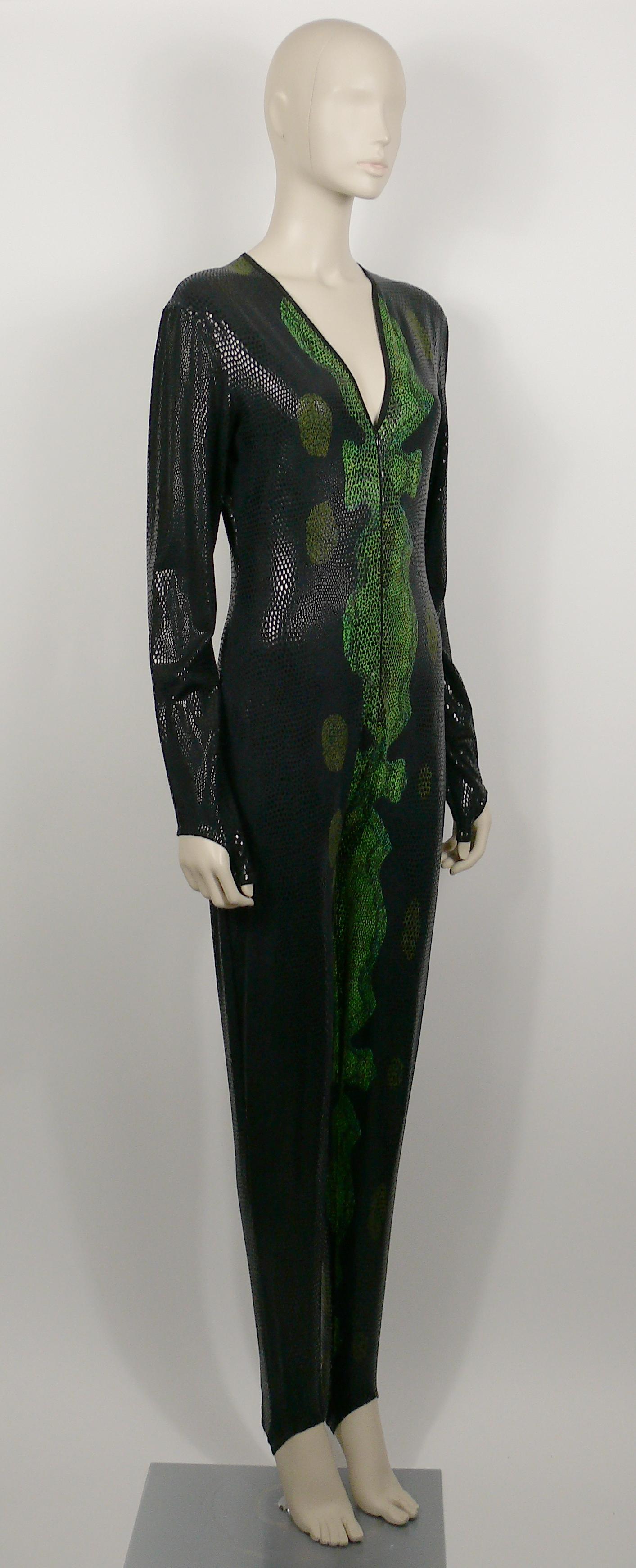THIERRY MUGLER vintage black and green reptile skin jumpsuit.

A very rare find from the 1998 Autumn/Winter Collection.

This overall features :
- Stretch fabric printed in spectacular glittering black and green reptile skin pattern. 
- Deep v-neck