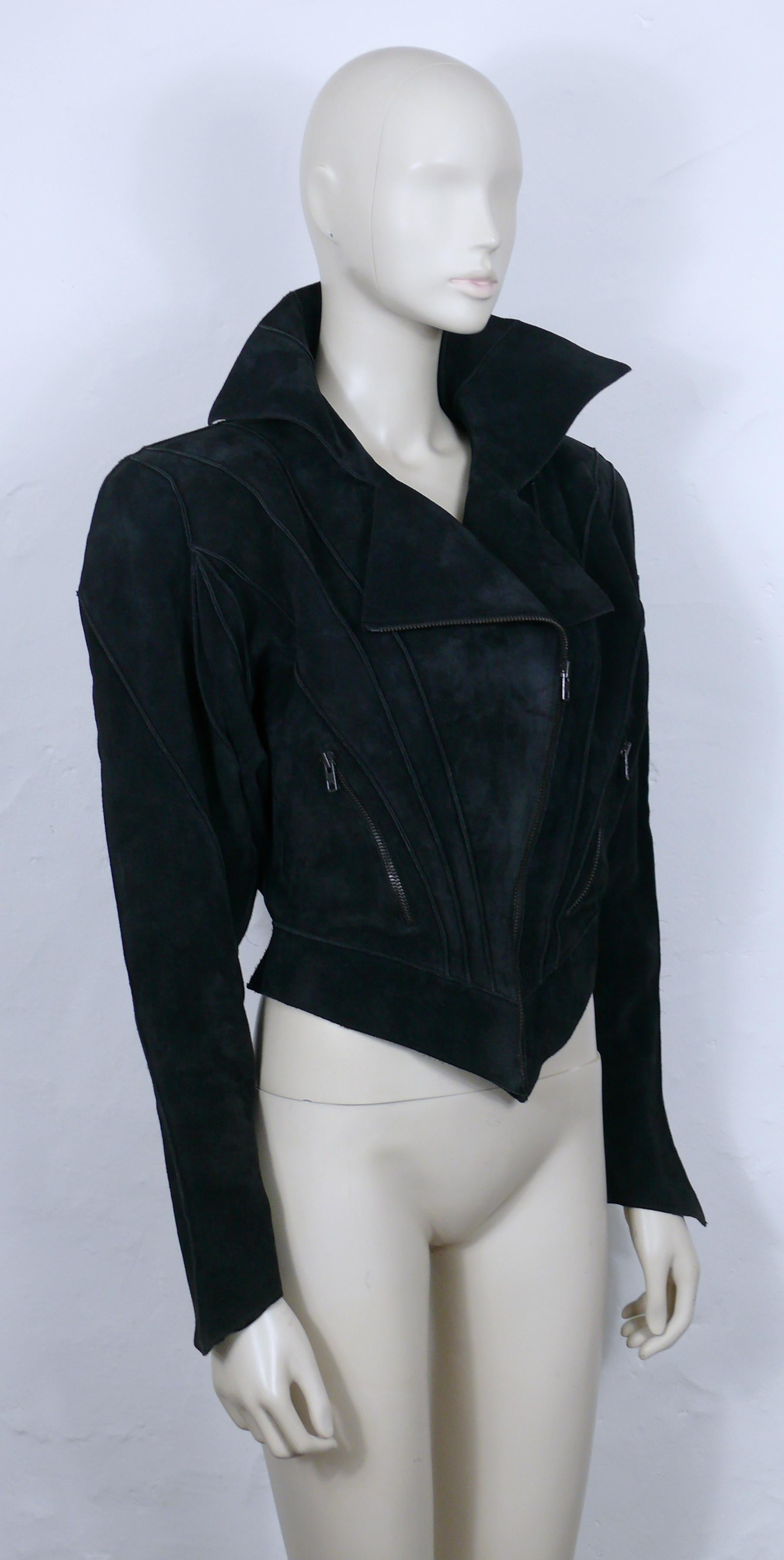 THIERRY MUGLER vintage rare black suede creature jacket.

This jacket features :
- Typical THIERRY MUGLER's sculptural cut and aesthetic with exaggerated shoulders and marked waist.
- Long bat sleeves.
- Stand-up collar.
- Asymetric front down