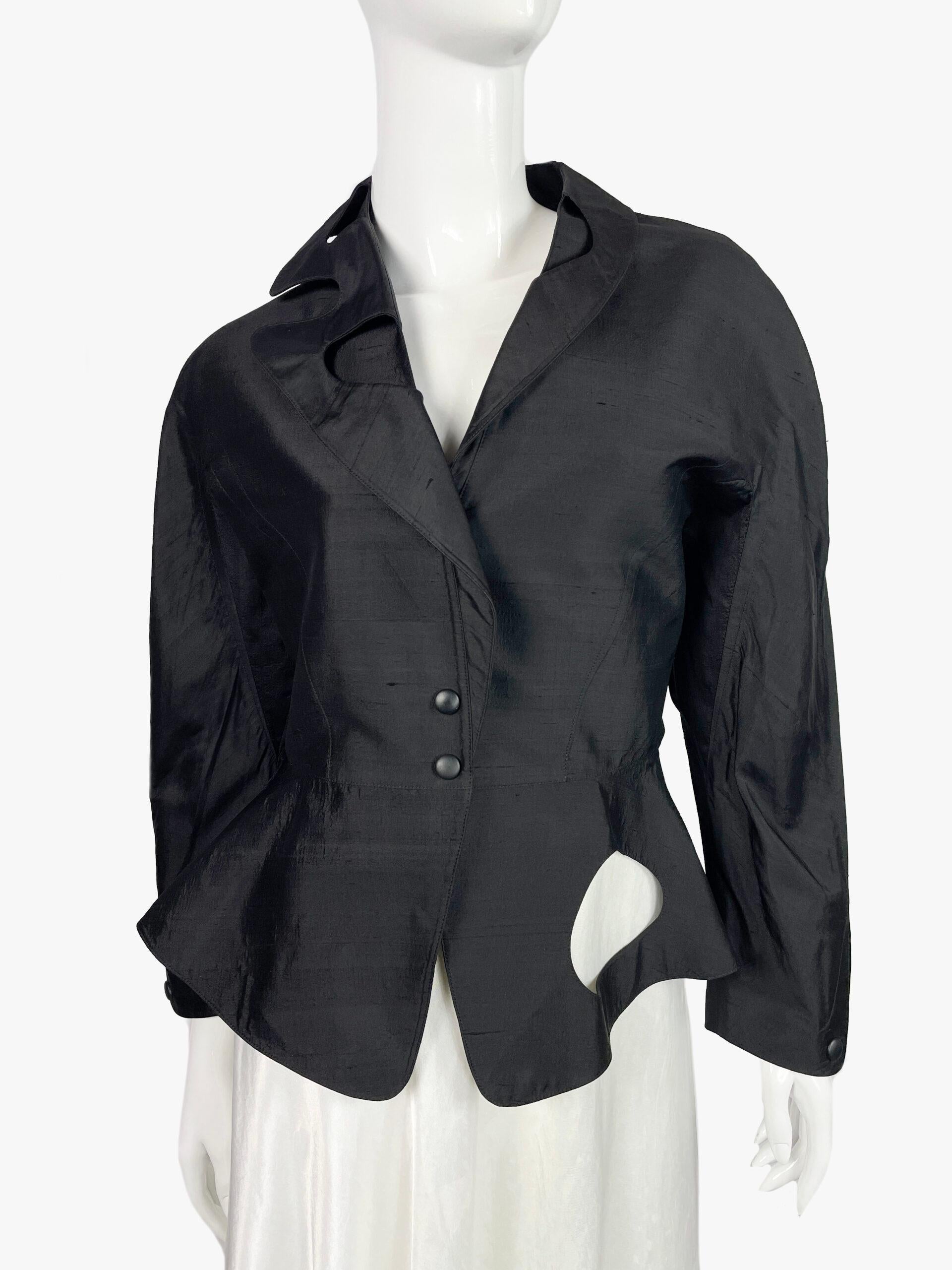 Vintage jacket by French couturier Thierry Mugler. 
V-shaped collar, fastens with 2 buttons
Period: 1990s
The main composition tag is missing, but there is a small inner tag that says it is 100% silk.
Size: 42/ L
Condition: Very good