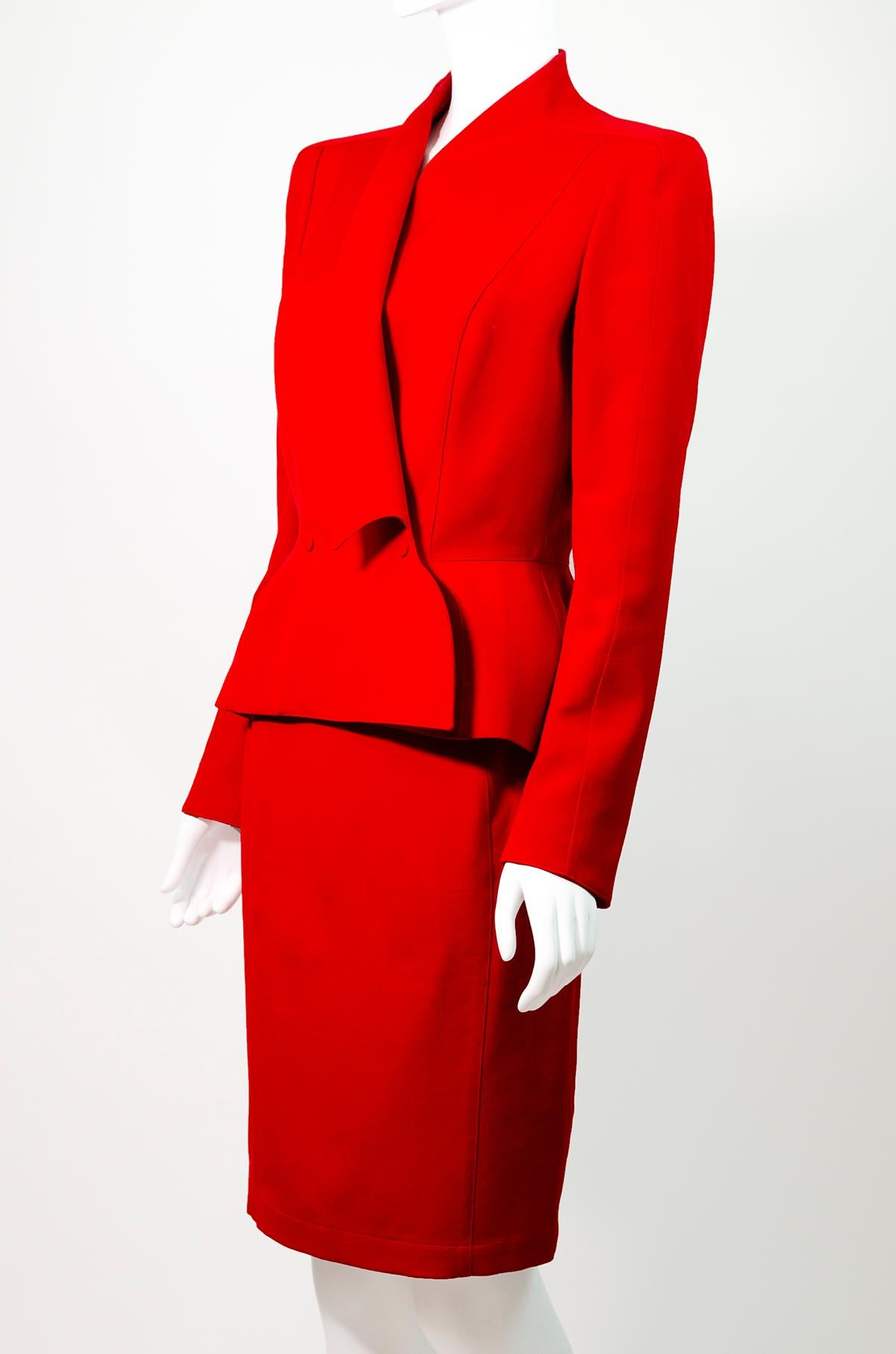 Incredible dramatic Thierry Mugler power suit from his Spring 1999 collection.

Truly an amazing piece, this ensemble features a long sleeve jacket and a pencil skirt and is tailored so beautifully in classic Thierry Mugler style. In a bold striking