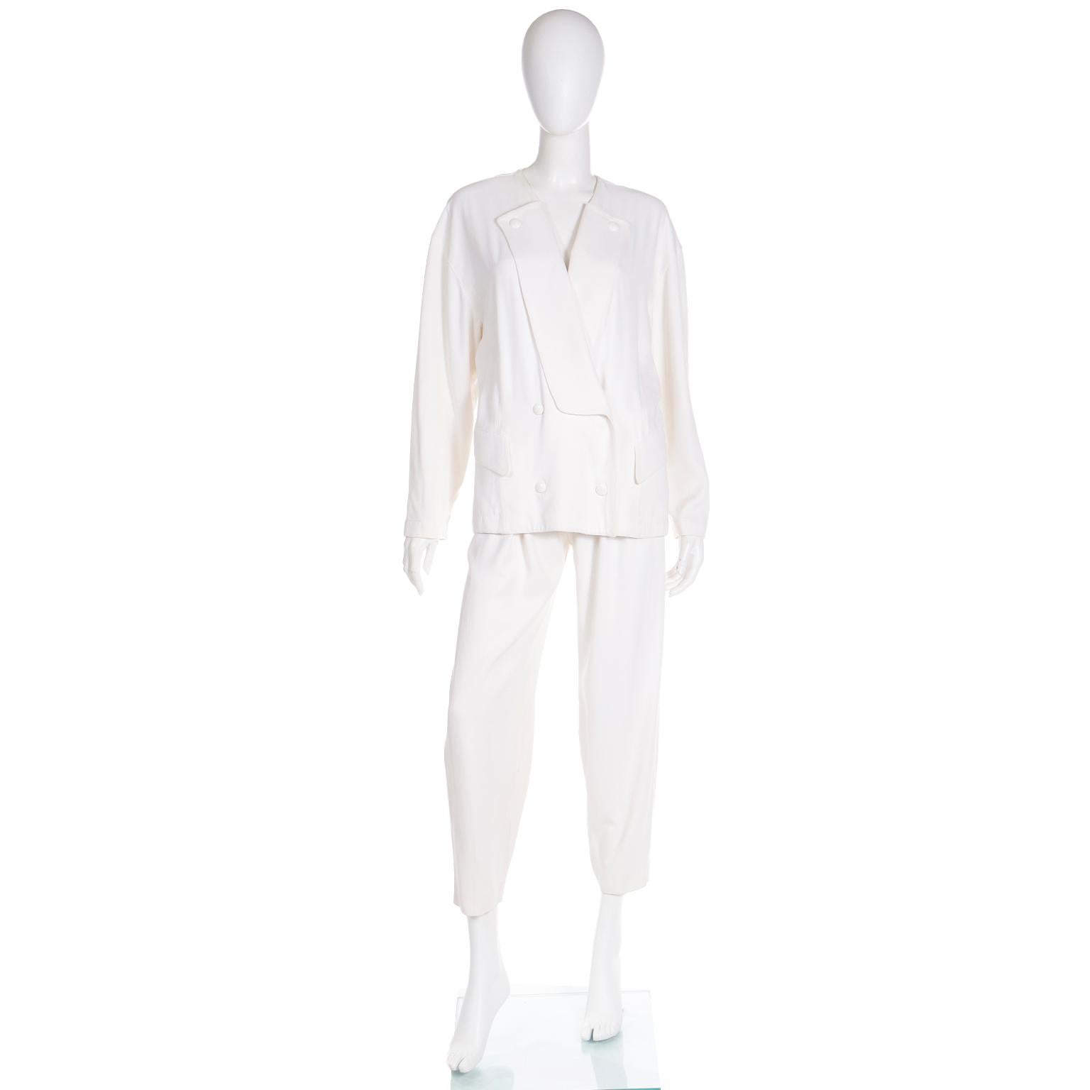 We love the way this vintage Thierry Mugler ivory cotton gabardine 2 piece suit is so easy to wear! The jacket has so much style and can be worn with so many other separates in your wardrobe. 

The double breasted jacket has Mugler's signature snaps