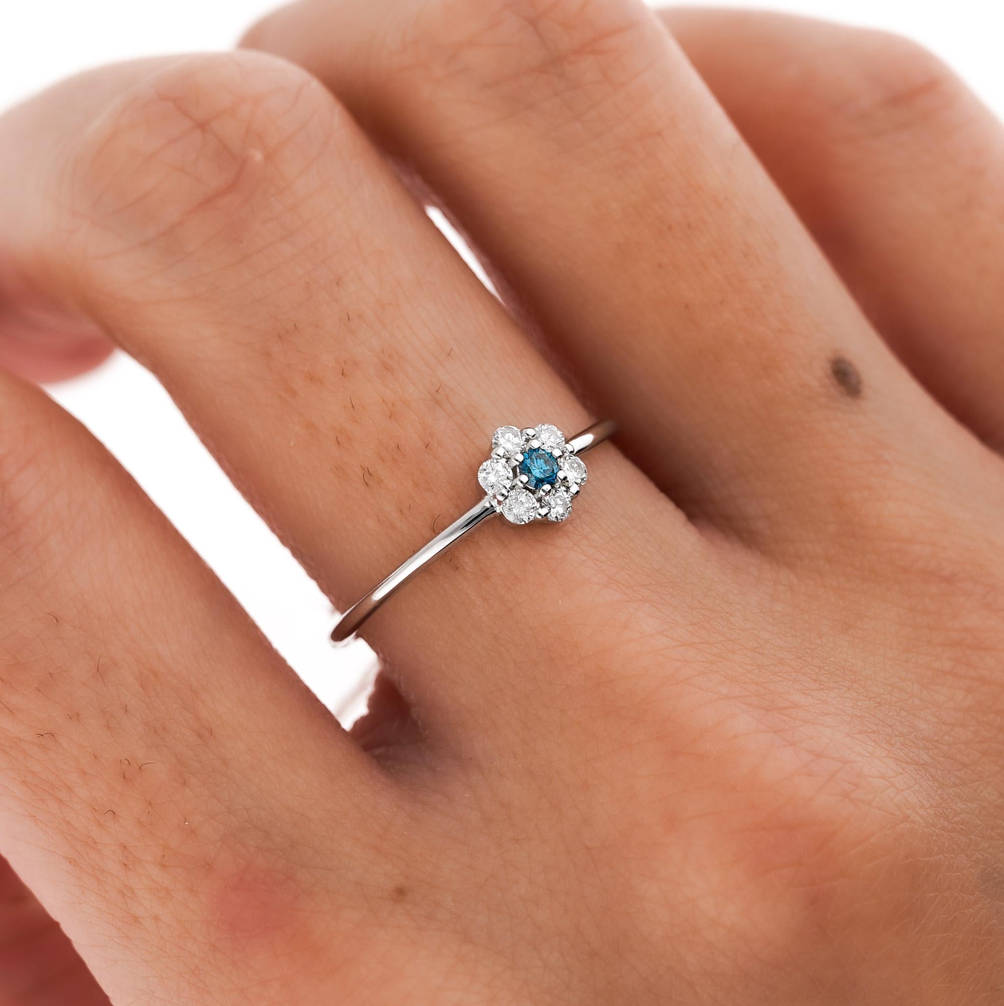 Cute, thin, and dainty. Get the perfect fine jewelry gift without breaking the bank. 

Set with natural blue and white diamonds and 14k solid gold. 

Details: 
✔ Metal: 14k White Gold
✔ Size: 6
✔ Weight: 0.90 grams
✔ Band/Shank Width: 1.12mm 