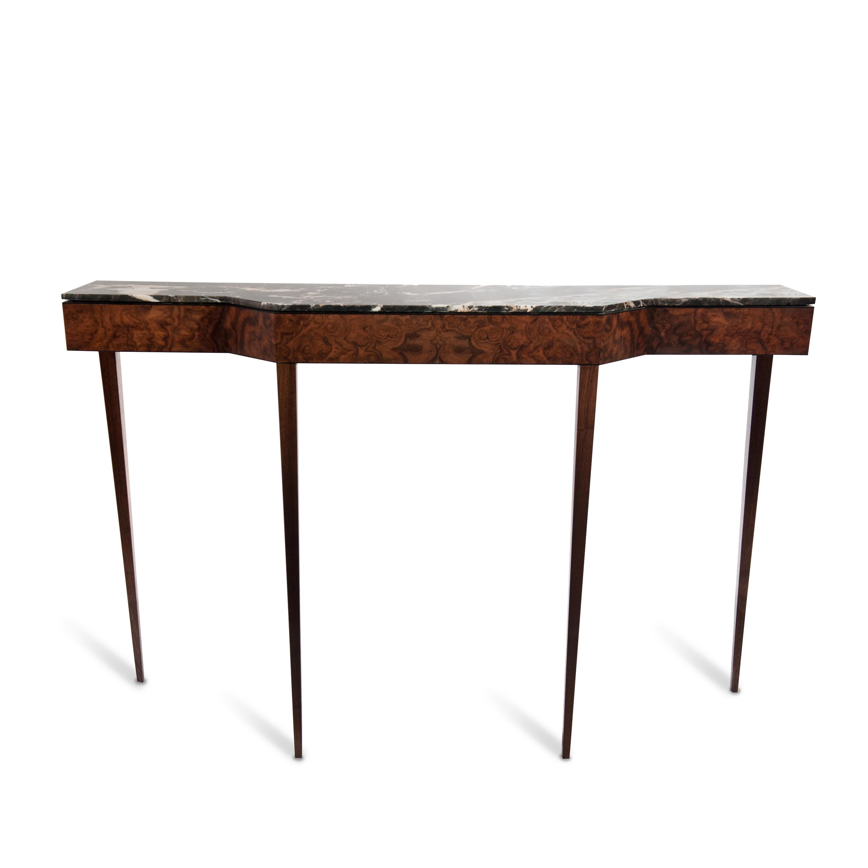 It's slim figure make it perfect for every space in particular the entrance area. 

The structure is veneered in burr walnut. The extra thin legs are made in solid walnut and the top is in dark marble.

Due to his thin figure we supply the fixing to