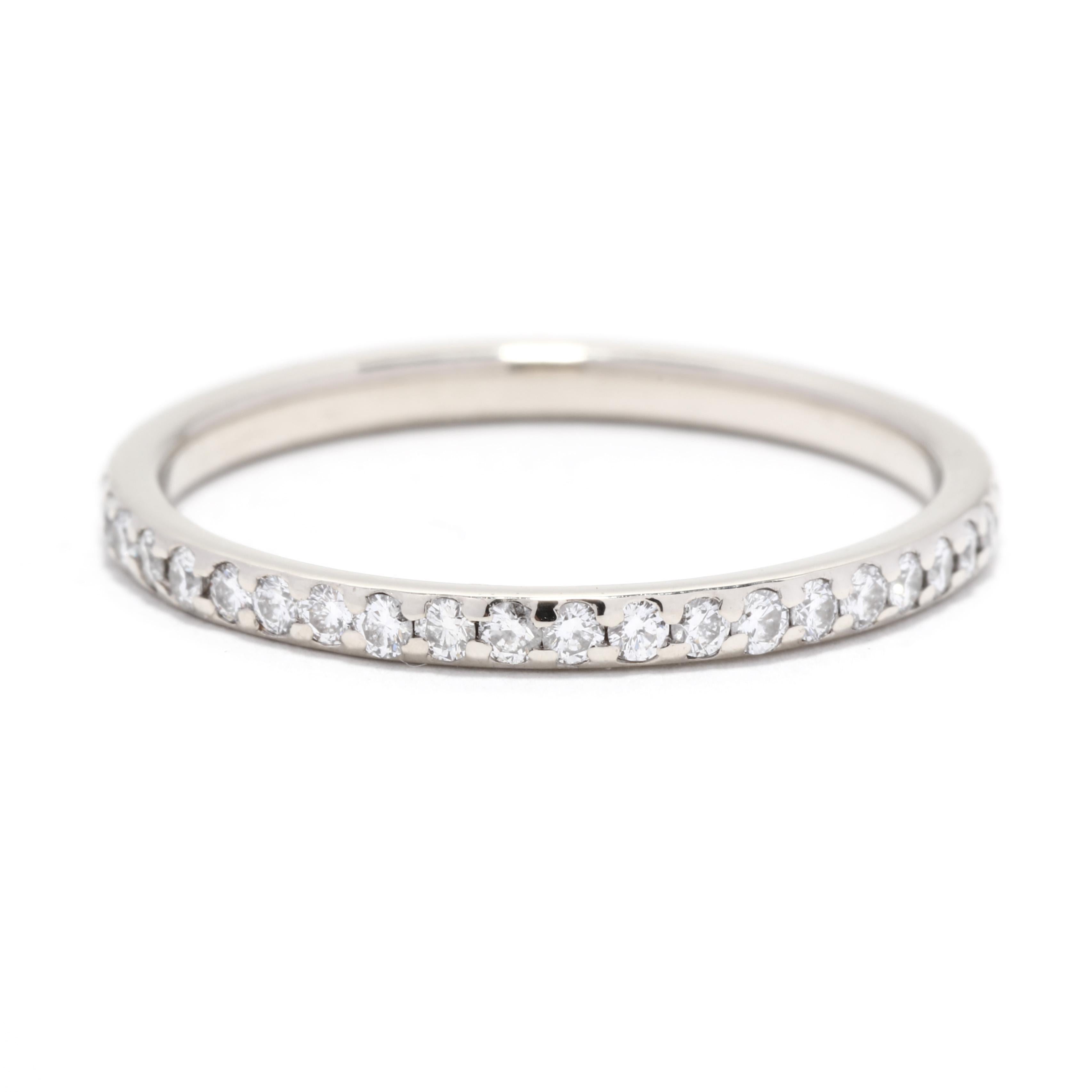 A vintage 18 karat white gold thin diamond eternity band. This stackable diamond band features an eternity design with flush set round brilliant cut diamonds weighing approximately .50 total carats.

Stones:
- diamonds, 44 stones
- round brilliant