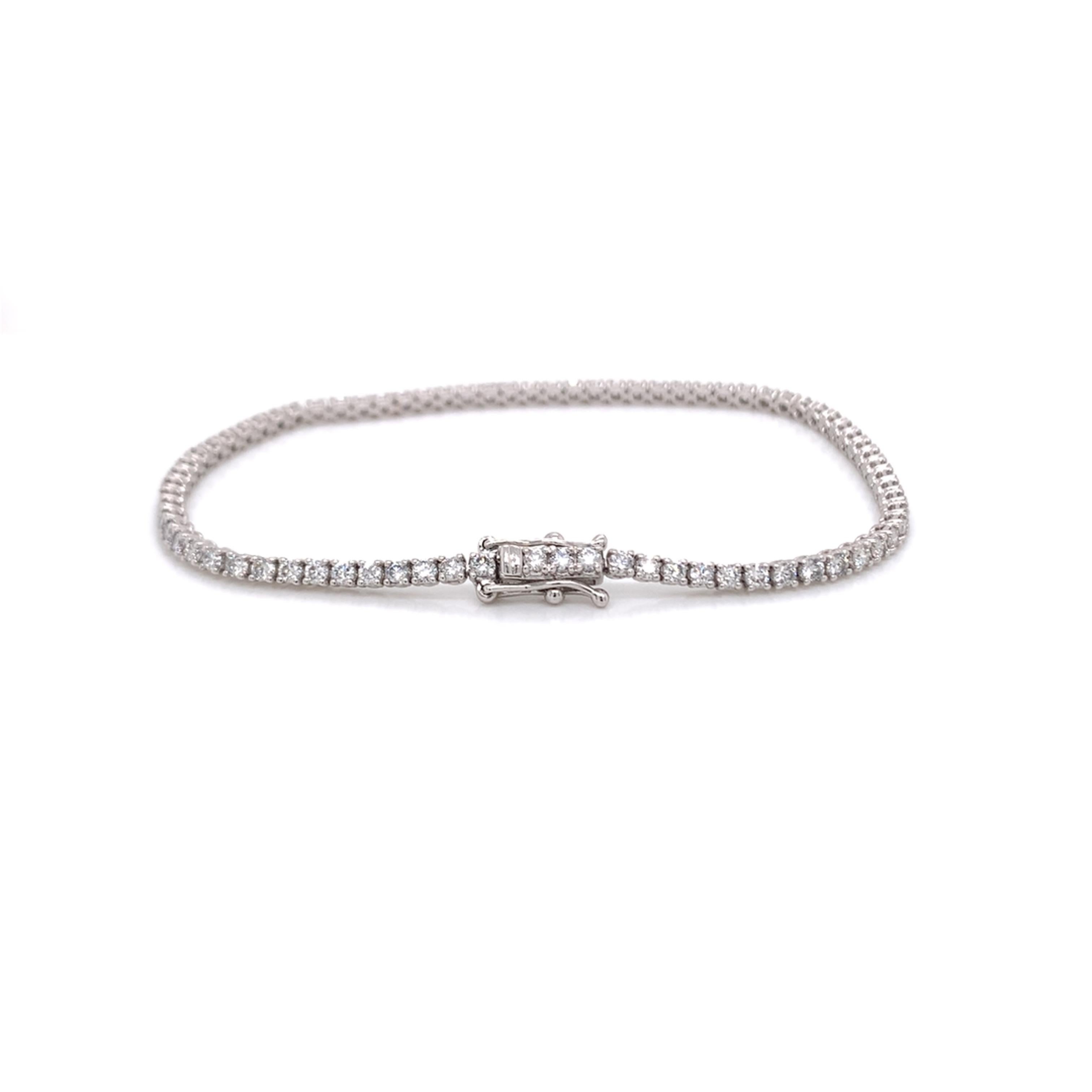 Thin/Small Diamond tennis bracelet made with real/natural brilliant cut diamonds. Total Diamond Weight: 2.39 carats. Diamond Quantity: 78 round diamonds. Color: G. Clarity: VS. Mounted on 18kt white gold.