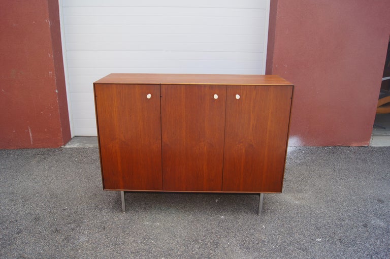 This teak gentleman's chest is part of the elegant series of case pieces that George Nelson designed for Herman Miller in 1952, rebranded the Thin Edge collection in 1958. Closed, it presents a slim profile, its minimal case resting on simple chrome