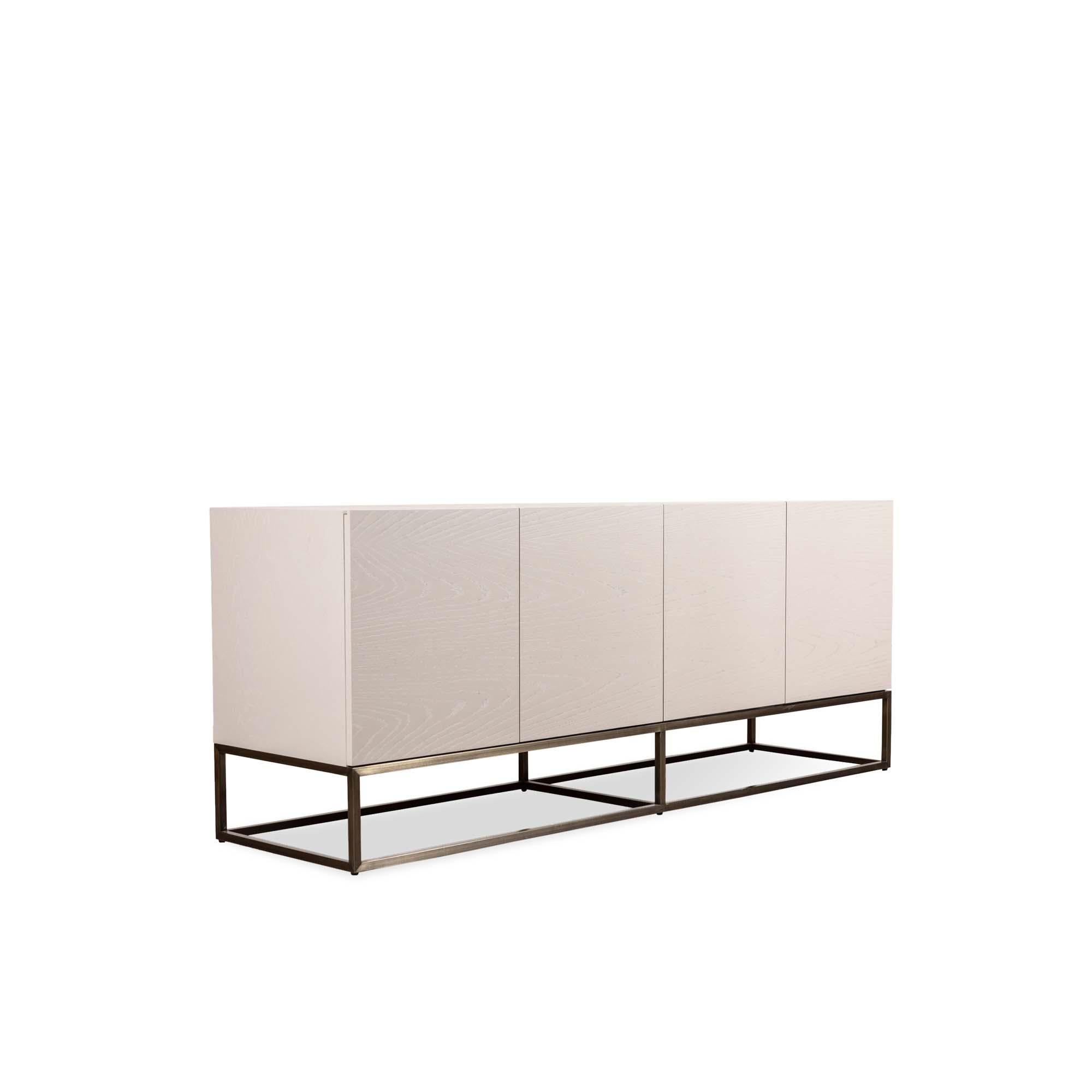 The thin frame cabinet is a four-door case piece with a thin, plated steel base. The interior includes one drawer and adjustable shelves. 

 The Lawson-Fenning Collection is designed and handmade in Los Angeles, California. Reach out to discover