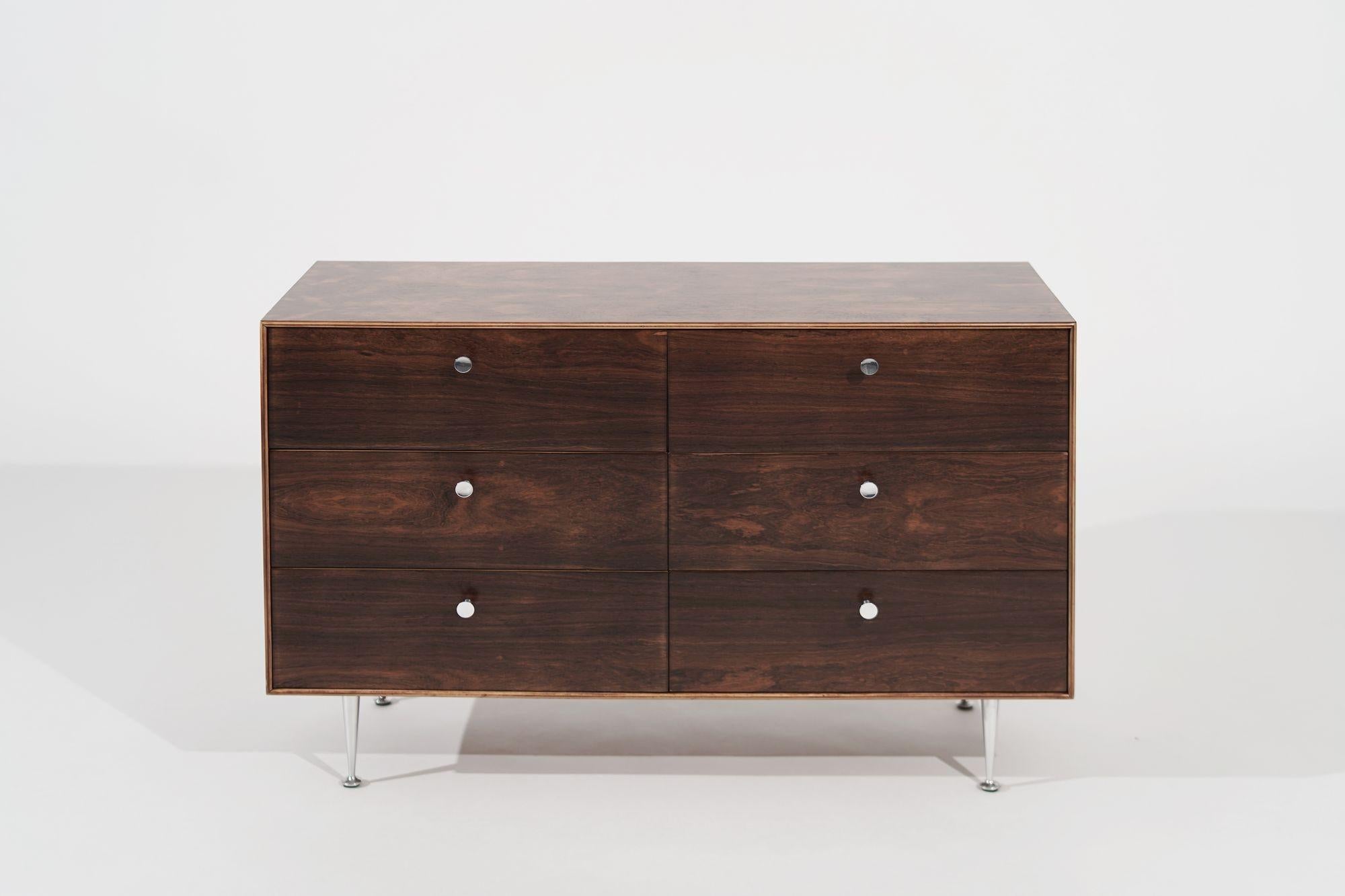 The exquisite Thin Line Rosewood Dresser by George Nelson for Herman Miller, meticulously restored to its original splendor by Stamford Modern. Crafted with timeless elegance, this mid-century modern piece showcases Nelson's unparalleled design