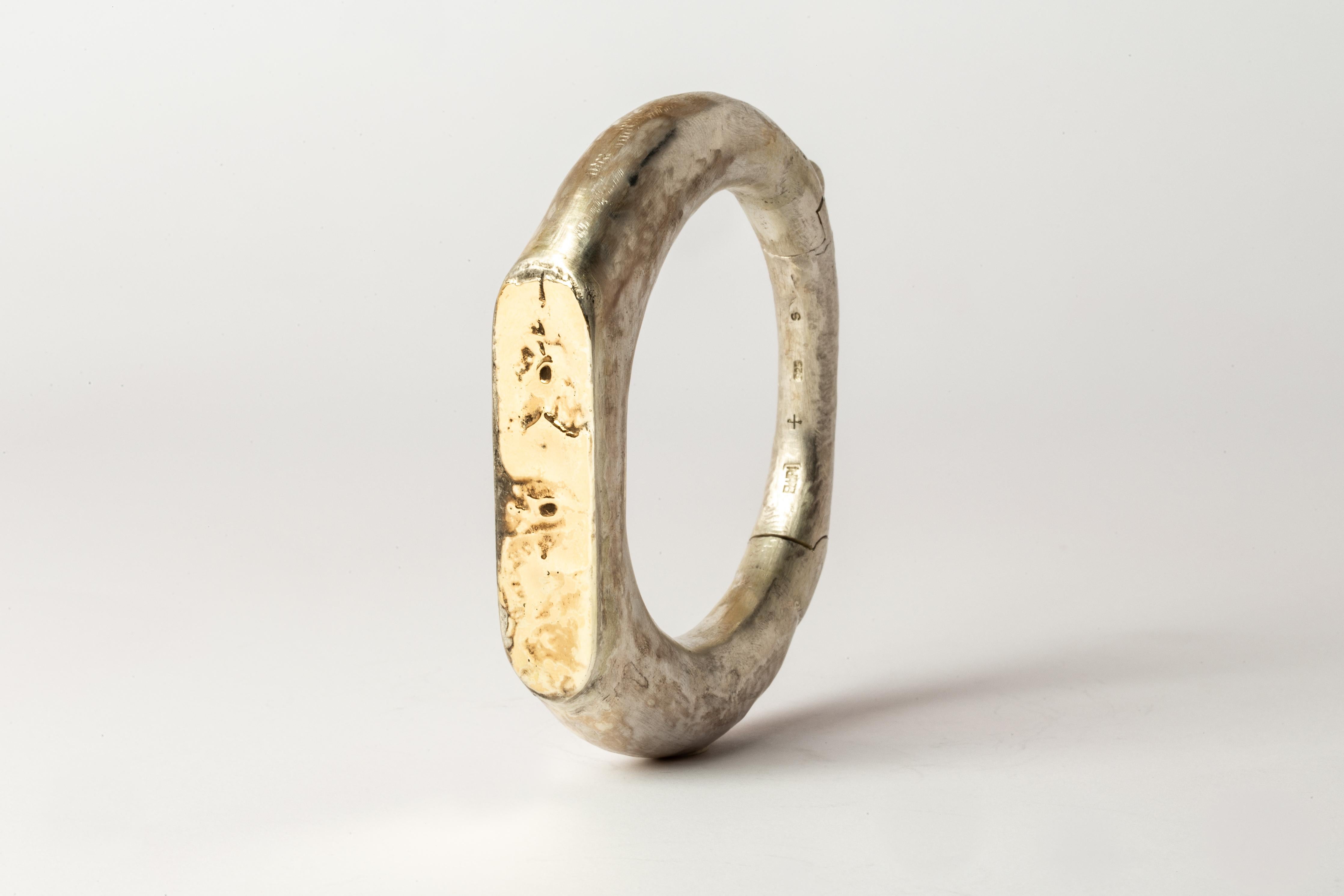 Bracelet in mate sterling silver with fused layer of 18K yellow gold. This item is made with a naturally occurring element and will vary from the photograph you see. Each piece is unique and this is what makes it special. This piece is 100% hand