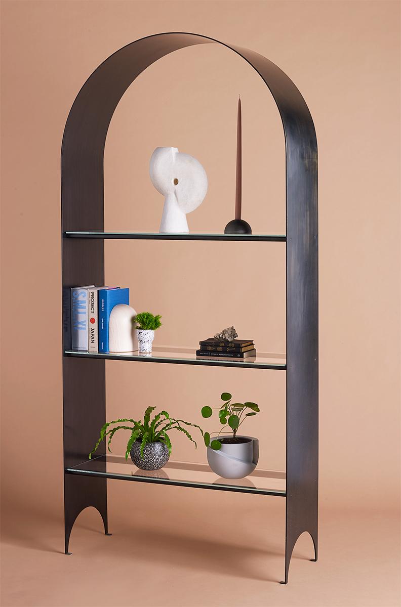 Thin shelf single, blackened steel, and Starphire glass the Thin shelf is the newest addition to the Thin series - a collection exploring the potential of rigid yet pliant steel plates. The blackened steel arch of the Thin shelf delicately extends