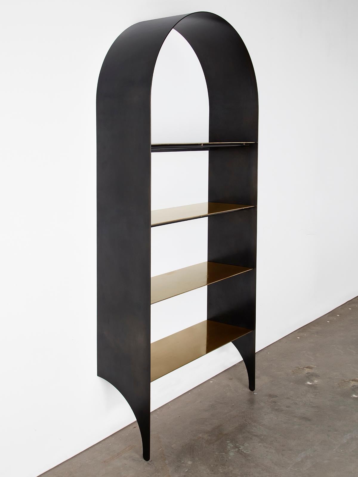 Thin shelf single, blackened steel and stainless steel inset shelves is the newest addition to the Thin series, a collection exploring the potential of rigid yet pliant steel plates. The blackened steel arch of the thin shelf delicately extends