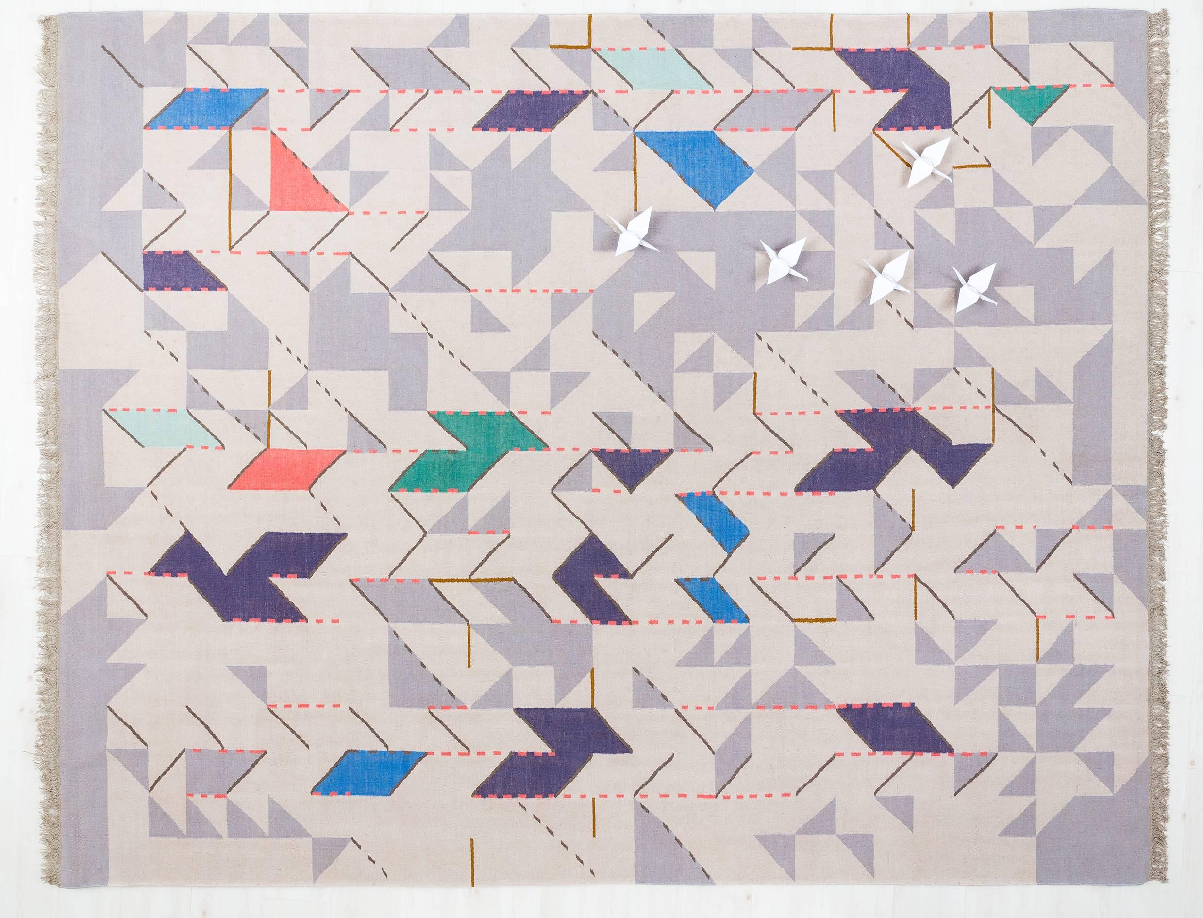 This is an open edition Kilim rug in the finest New Zealand wool, woven by Odabashian's network of family-owned weavers near Mirzapur, India. The design was created by Miami based artist, Johanna Boccardo for Zona Maco Contemporary Art Fair,