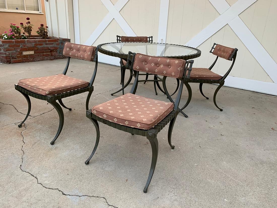 Thinline cast aluminum Klismos dining set.
Table and four chairs. Table measures: 43 3/4