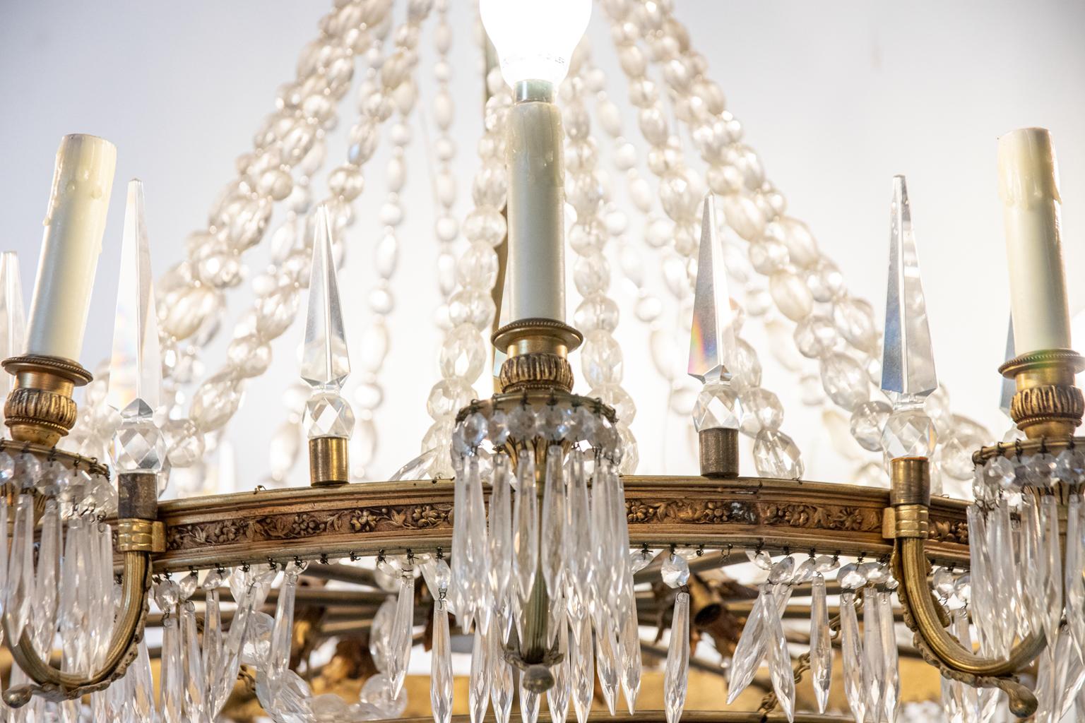 Thirteen Arm Crystal and Bronze Three Tier Chandelier In Good Condition For Sale In Stamford, CT