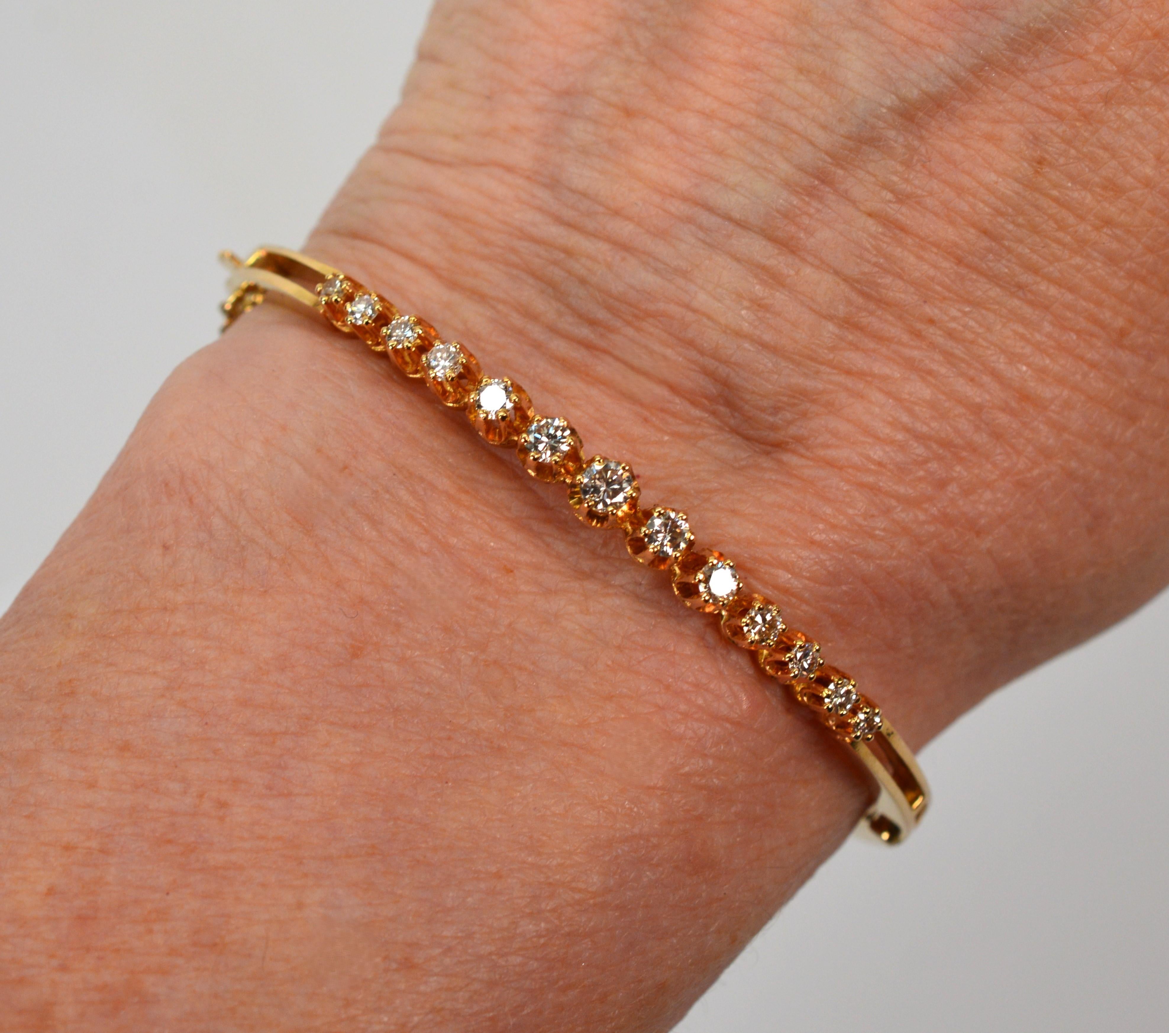 Women's Thirteen Diamond 14 Karat Yellow Gold Bangle Bracelet For Sale
