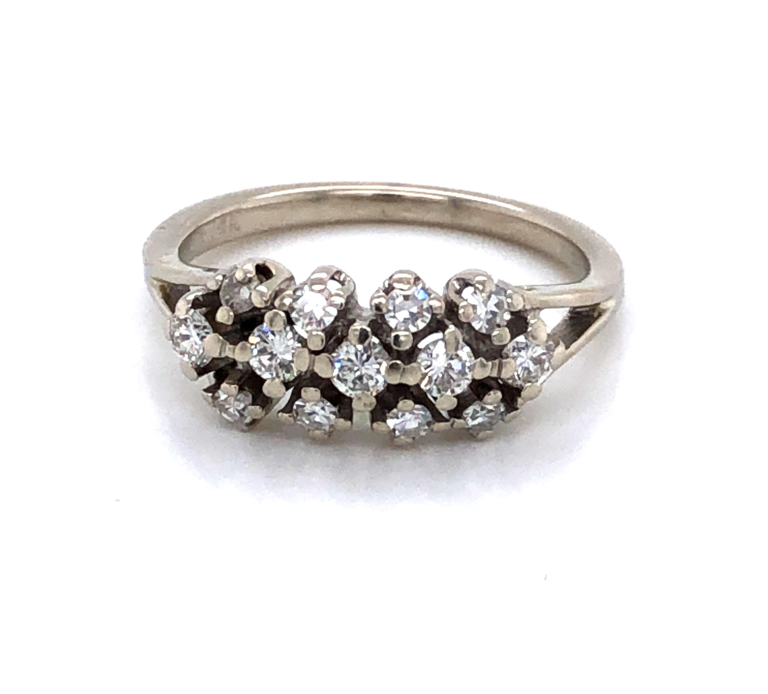 Treat yourself and brighten your day or surprise that special someone to mark an occasion with this sparkler. Thirteen brilliant H/SI diamonds, with a total carat weight of .41 carats, are bezel set and arranged in an attractive and impactful