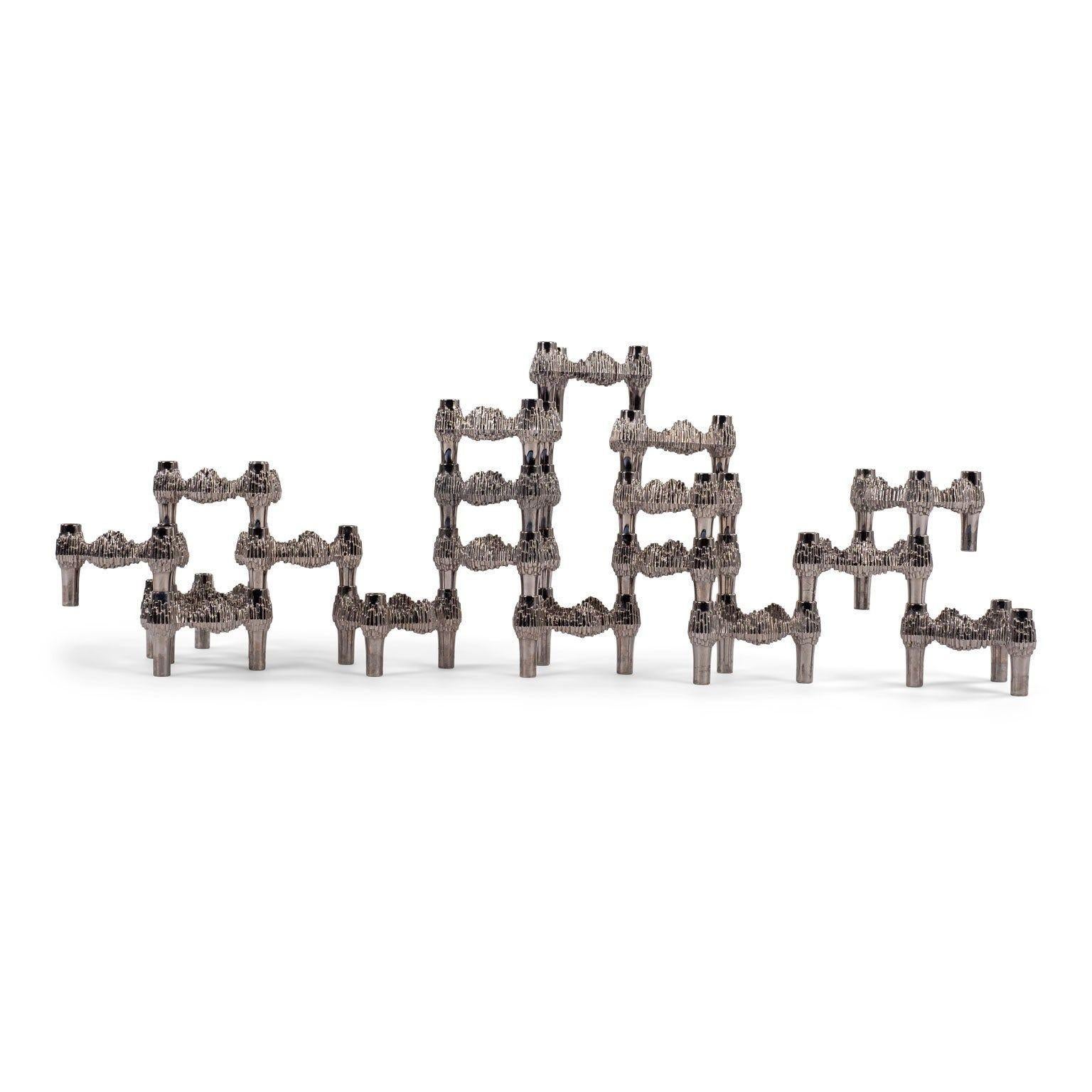 Thirteen original nickel-plated Variomaster candle holders designed by Caesar Stoffi & Fritz Nagel. Manufactured by Quist/BMF in West Germany during the 1970s. Model: Variomaster-3 flame. Can be stacked and arranged in infinitely different ways.