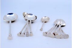 Thirteen silver dessert spoons: sauce, ice-cream, sugar and tea spoons