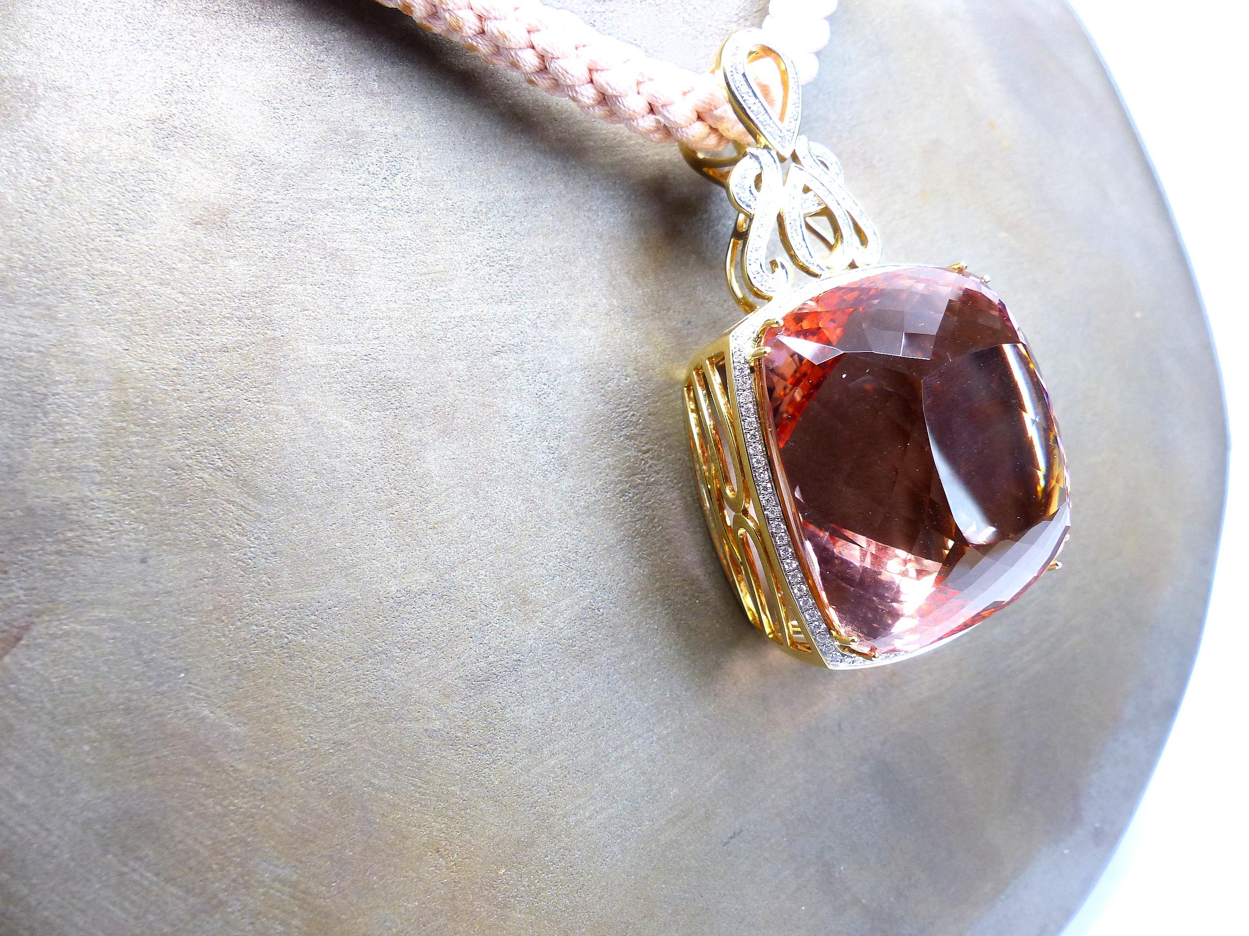 This piece of art is a part of a jewellery heritage collection.

The pendant is made in 750/yellow gold (28,96gr.). The dimension is 70x38x31mm. It has as the center stone 1 facetted and unheated Morganite (rose Beryll) from Mocambique in cushion