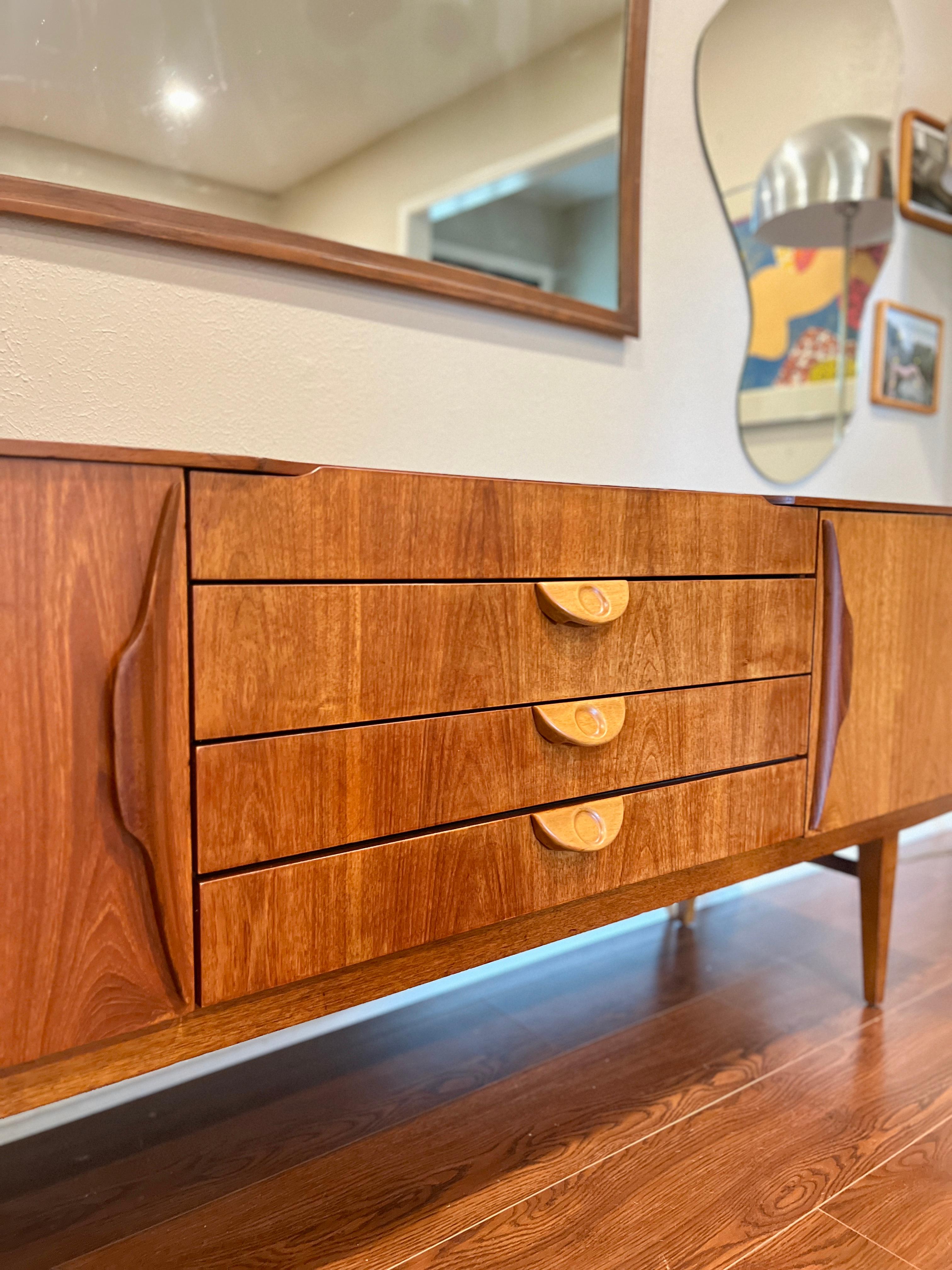 Mid-Century Modern This beautiful mid century modern sideboard by Beautility, circa 1960s