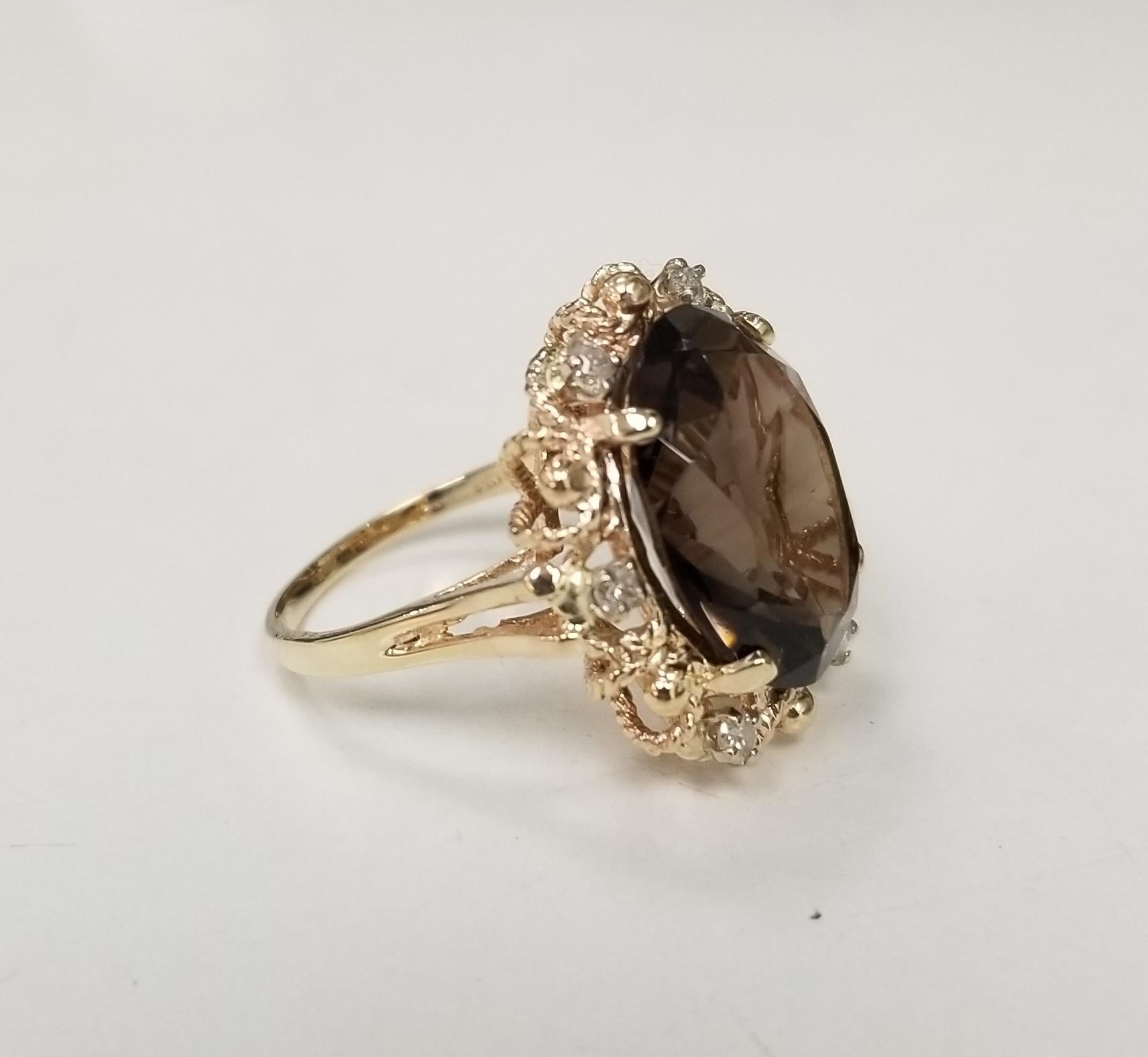 This beautiful Vintage 14k yellow gold topaz and diamond ring, containing 
Specifications:
    main stone: OVAL CUT TOPAZ STONE 16mm x 12mm  
    addition; 6 round diamons .25pts.
    brand: CUSTOM 
    metal: YELLOW GOLD
    type: ring
    weight: