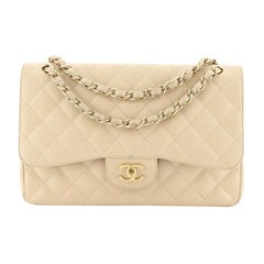 This Chanel Classic Double Flap Bag Quilted Caviar Jumbo