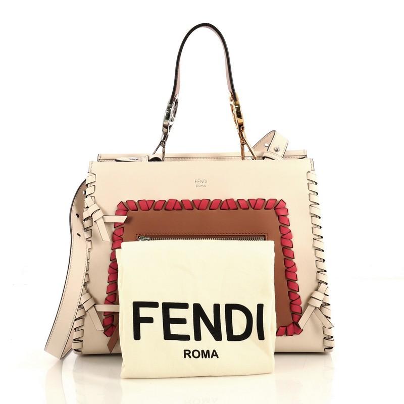 This Fendi Runaway Handbag Whipstitch Leather Small, crafted from white, red, and brown leather, features a flat leather handle, exterior zip pocket, whipstitch detailing, and silver and gold-tone hardware. Its magnetic snap button closure opens to