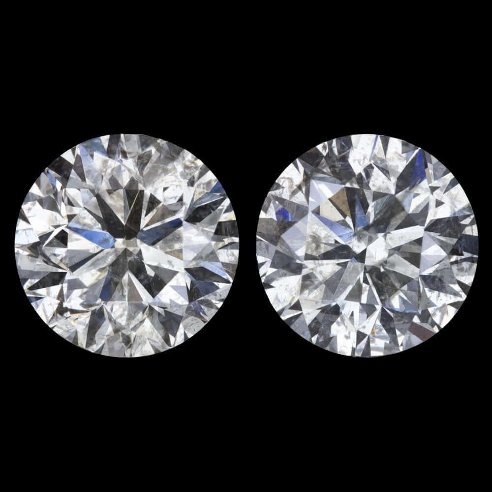 Round Cut This gorgeous 6.17ctw pair of round brilliant cut natural diamonds