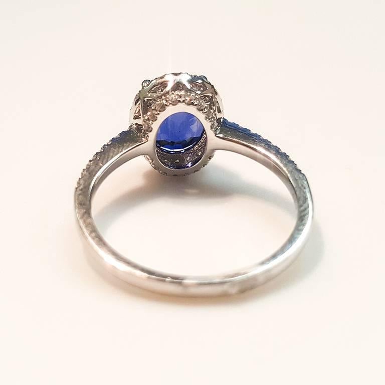 Oval Cut This Ladies 14 Karat White Gold Sapphire and Diamonds Ring For Sale