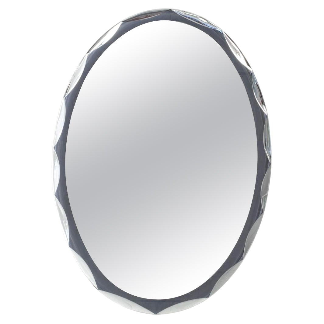 This Oval, Italian Wall Mirror Dates from the 1960s