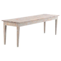 This wonderfully shabby chic table has a long rectangular top, supported by four