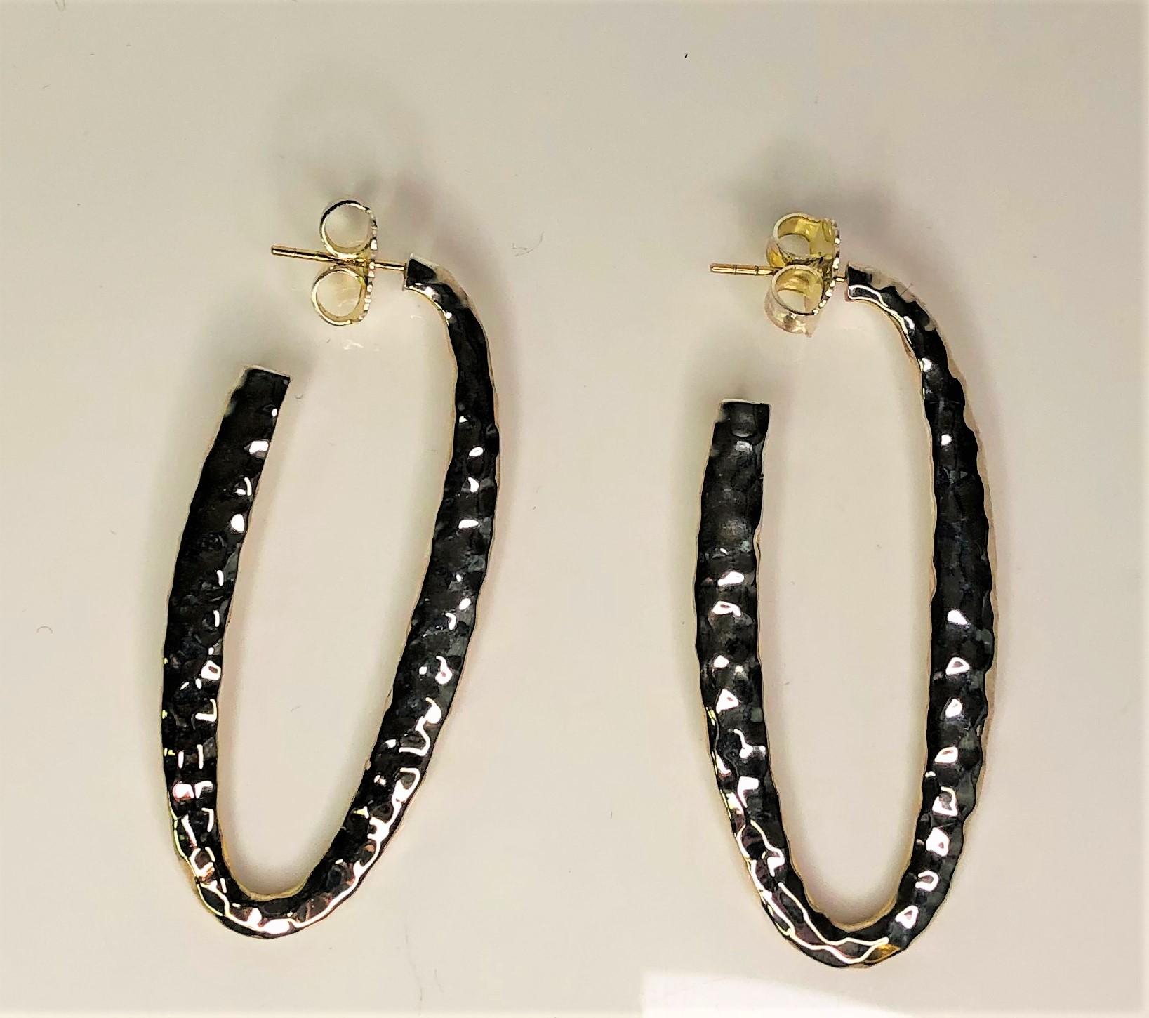 By Thistle & Bee, these elongated hammered hoop earrings will be a favorite!
Sterling Silver, hammered, with 14K gold posts
Approximately 2 1/16 inches long x 7/8 inch wide and 1/16 inch thick
Post with friction back
Stamped 