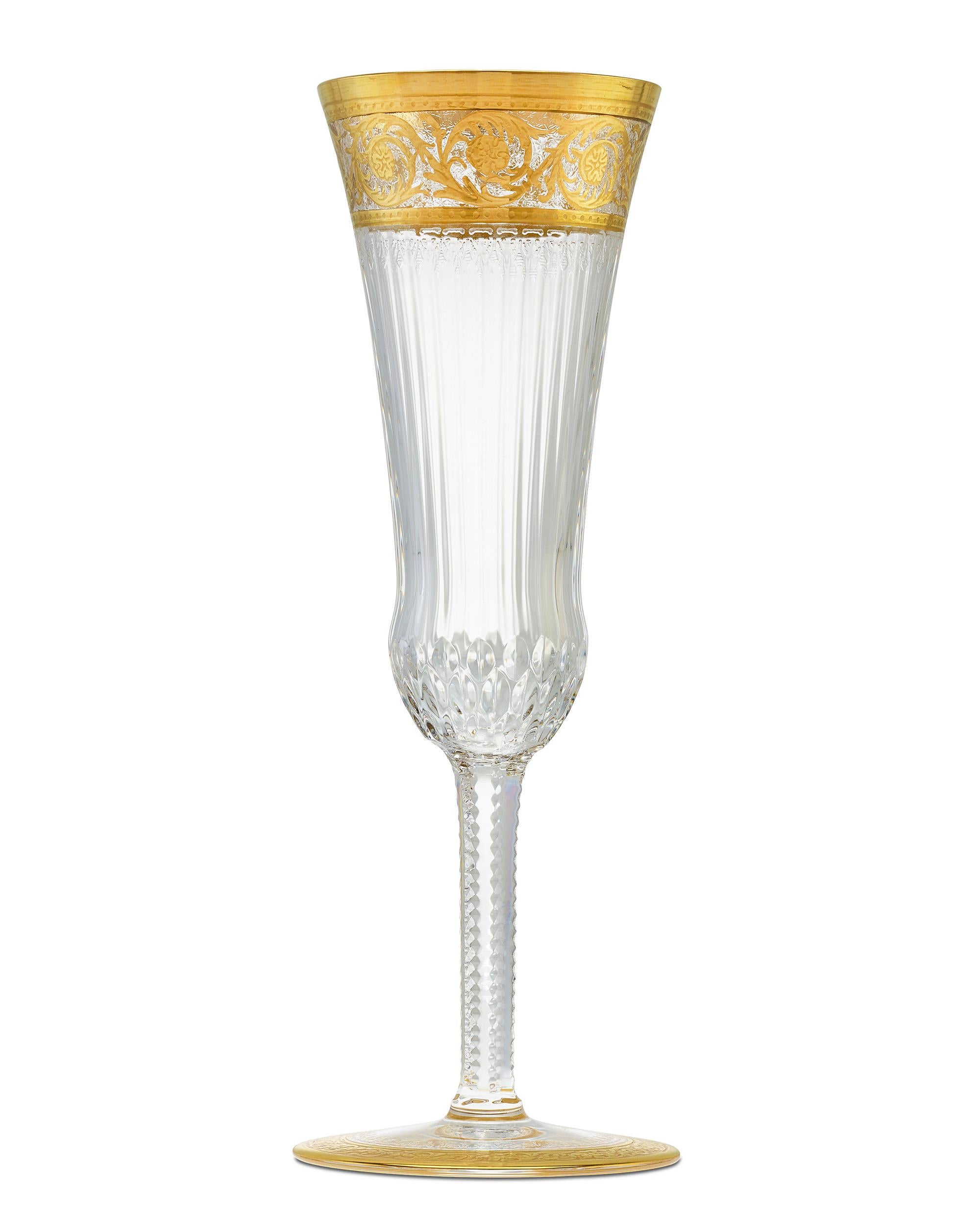 These beautifully designed crystal champagne flutes were crafted in the Thistle pattern by the legendary French glass manufacturer Saint-Louis Crystal. The pattern was created for the International Exhibition of the East of France held in 1909 at