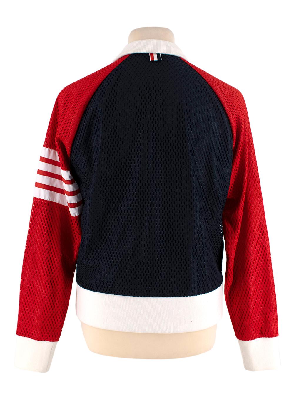 Thom Brown Tricolour AirTex Track Jacket

- Tricolour track-style jacket in the signature Thom Browne hues of red, navy and white
- Funnel neck, zip-through
- AirTex sports material
- Ribbed collar, cuffs & hemline 
- 2 side pockets

Materials 
100%