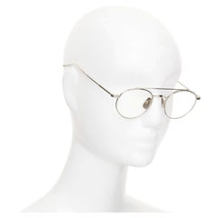 Gafas ópticas THOM BROWNE 18-101-A-SLV-49, con patillas metálicas plateadas y montura redonda transparente