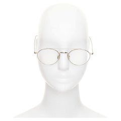 Gafas ópticas THOM BROWNE 18-101-A-SLV-49, con patillas metálicas plateadas y montura redonda transparente