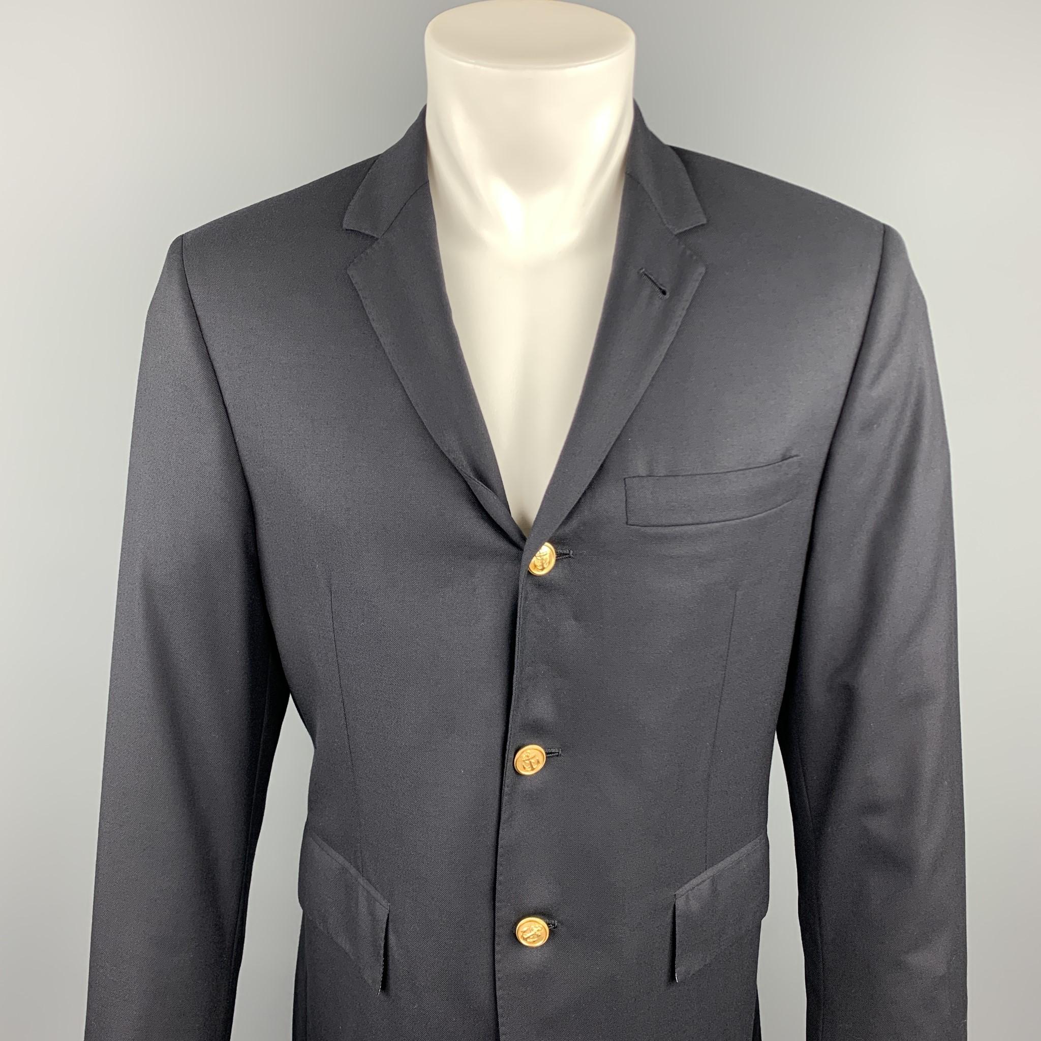THOM BROWNE sport coat comes in a navy wool featuring a notch lapel style, flap pockets, and a three button closure. Hand made in USA.

Excellent Pre-Owned Condition.
Marked: 40 R

Measurements:

Shoulder: 15.5 in. 
Chest: 38 in.
Sleeve: 25.5 in.