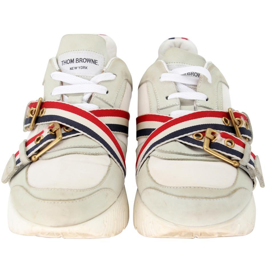 Thom Browne Double Strap 42 Sneakers TB-0901N-0002

For the casual fashionista, this Thom Browne Canvas and Calfskin Leather Men's Trainer Sneakers are a classic style with a chic detail. These shoes feature leather detail and adjustable shoe strap