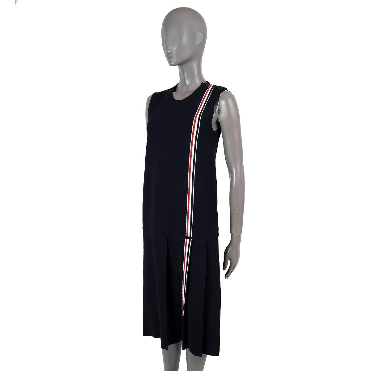 100% authentic Thom Browne sleeveless knit dress in navy blue viscose (75%) and polyester (25%). Features a crewneck, classic red-white-blue cricket strip and asymmetric pleated skirt. Unlined. Has been worn and is in excellent condition.