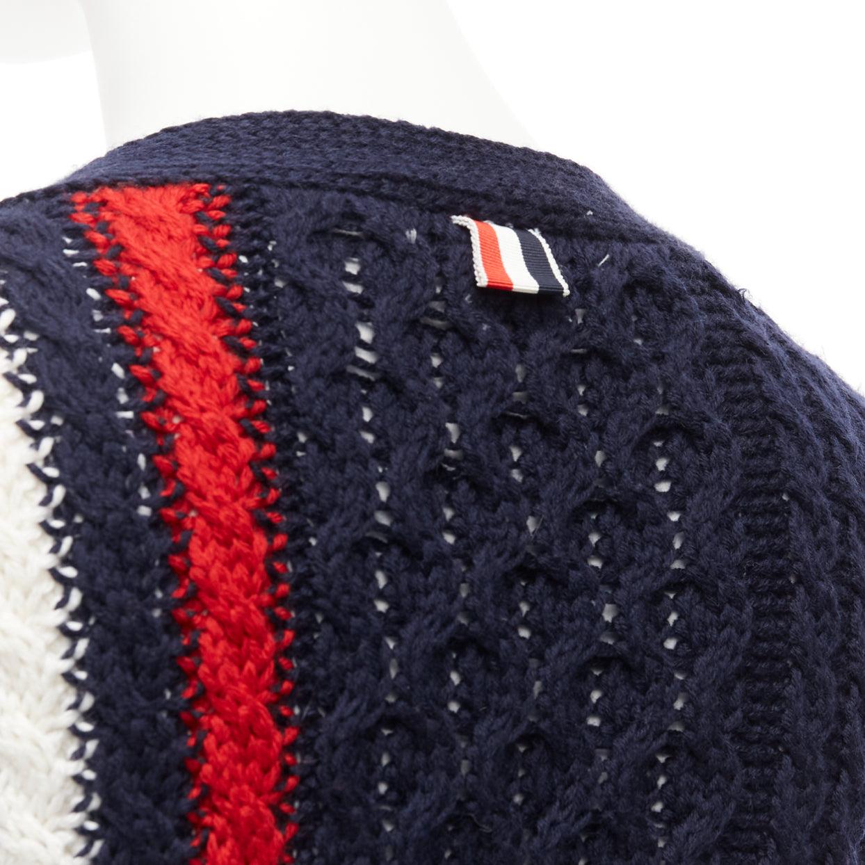 THOM BROWNE navy red white wool aran cable knit cardigan sweater IT40 S
Reference: DYTG/A00053
Brand: Thom Browne
Designer: Thom Browne
Material: Wool
Color: Navy, Red
Pattern: Striped
Closure: Button
Extra Details: Red white knitted detail at