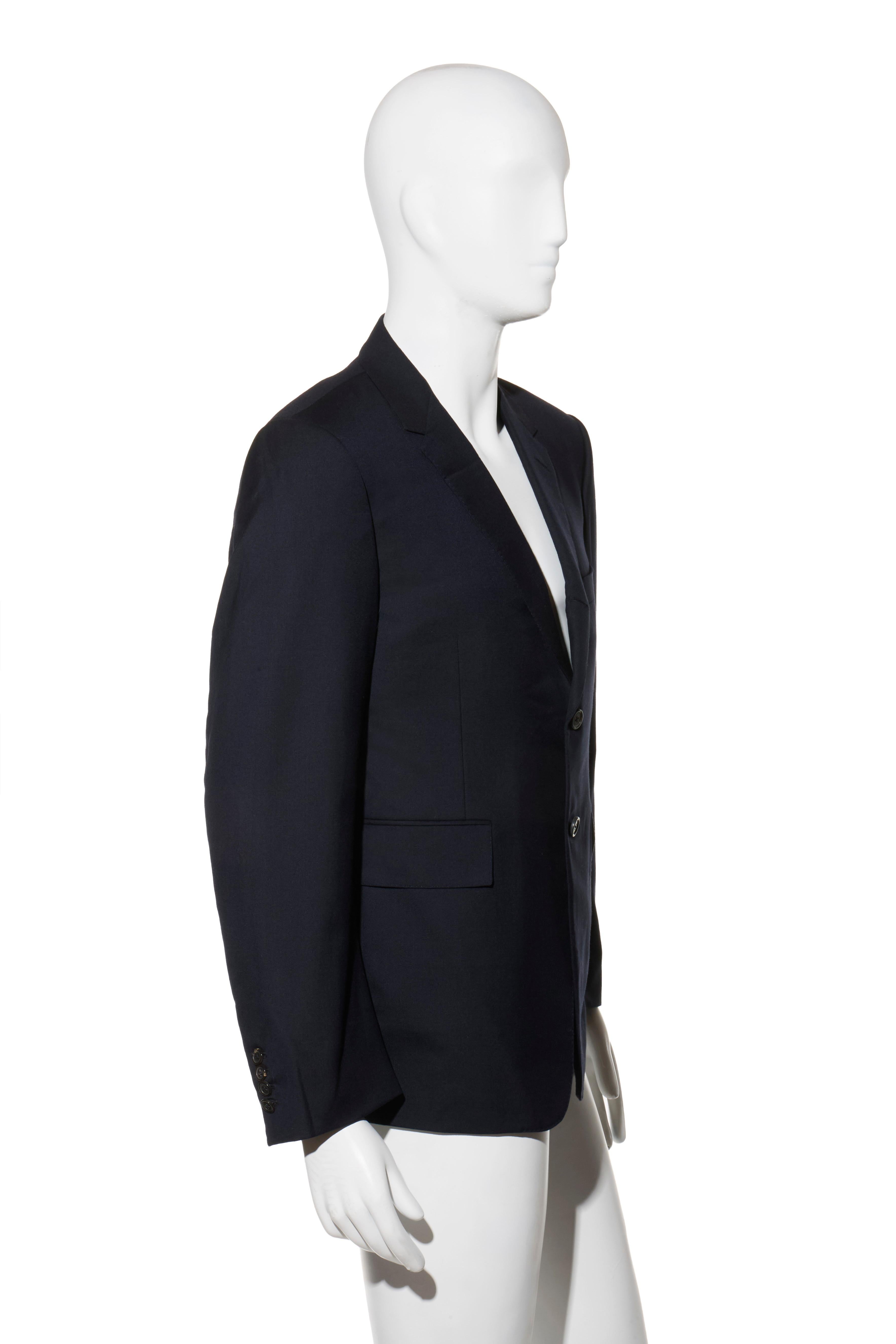 Thom Browne Navy Wool Blazer Size 52R (US 42R)

Description:
An impeccably tailored Thom Browne New York men’s blazer crafted from 100% wool and lined in the brand’s signature striped cupro. Designed with a structured silhouette, two-button closure,