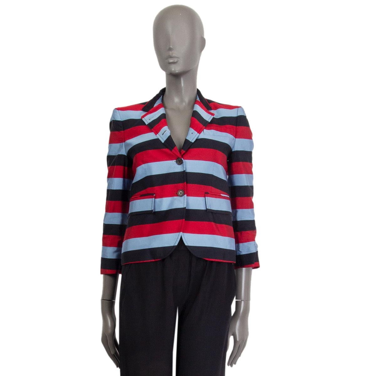 100% authentic Thom Browne striped blazer in red, light blue, black silk (58%) and cotton (42%) with notch collar and two flap pockets on the front. Closes with three buttons on the front and has buttoned cuffs. Lined in striped red, blue and white