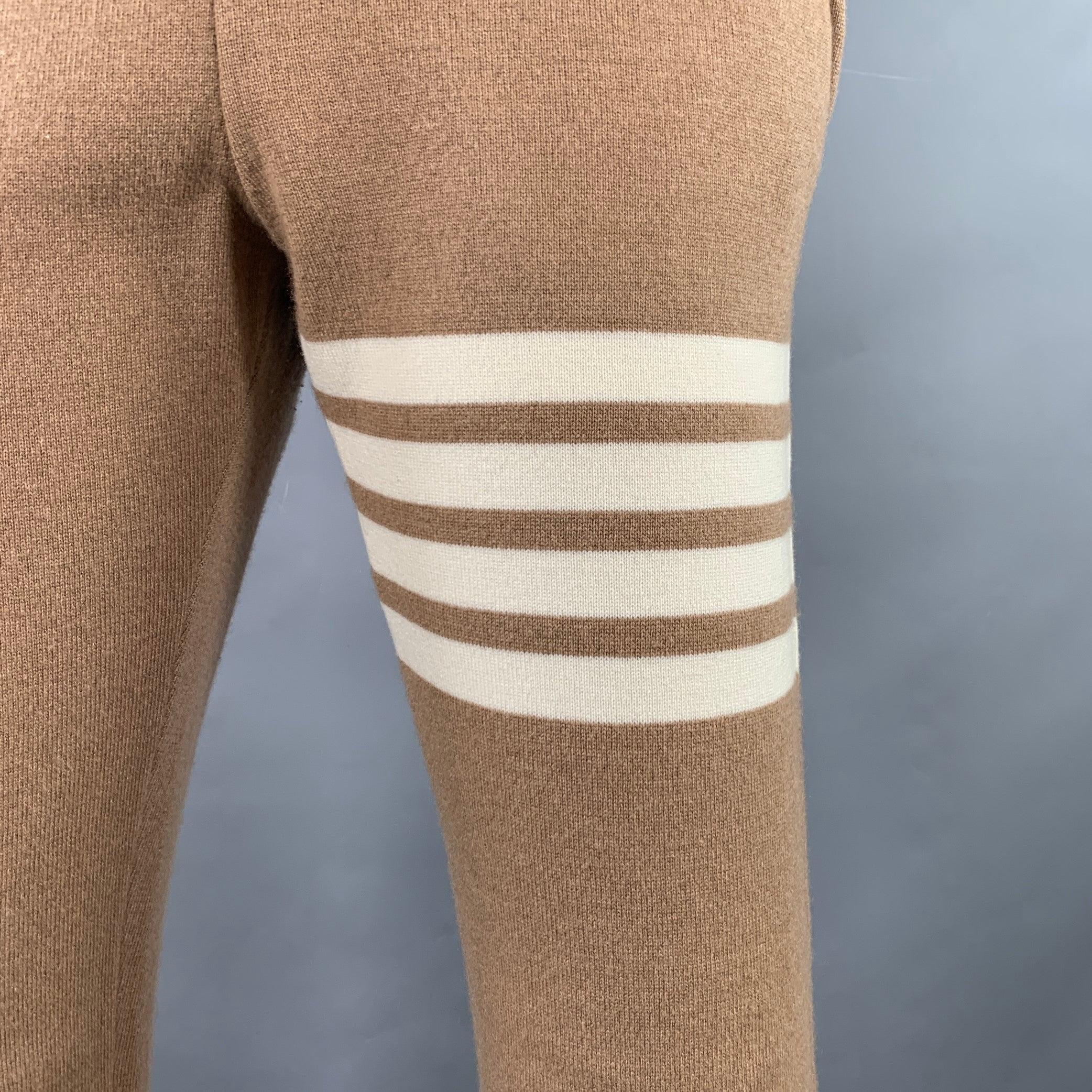 THOM BROWNE casual pants
in a brown cotton blend knit featuring cream signature stripes, rib knit cuffs, and drawstring waistband. Made in Italy.Excellent Pre-Owned Condition. 

Marked:   IT 36 

Measurements: 
  Waist: 28 - 32 inches Rise: 8.5