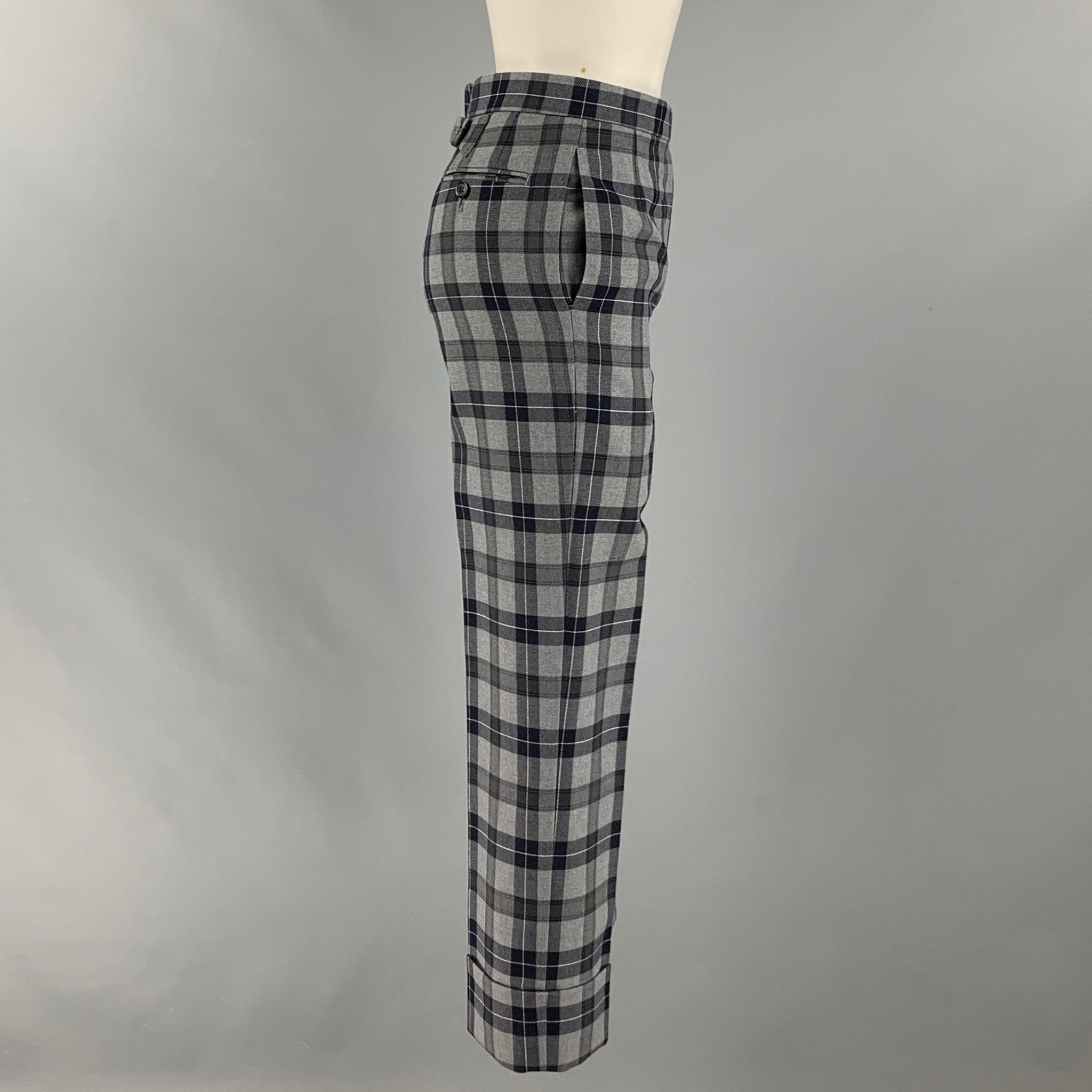 THOM BROWNE dress pants comes in a grey and black plaid wool twill featuring a high waist, cuffed leg, front tab, and a button fly closure. Made in Italy.Excellent Pre-Owned Condition. 

Marked:   00 

Measurements: 
  Waist: 28 inches Rise: 11