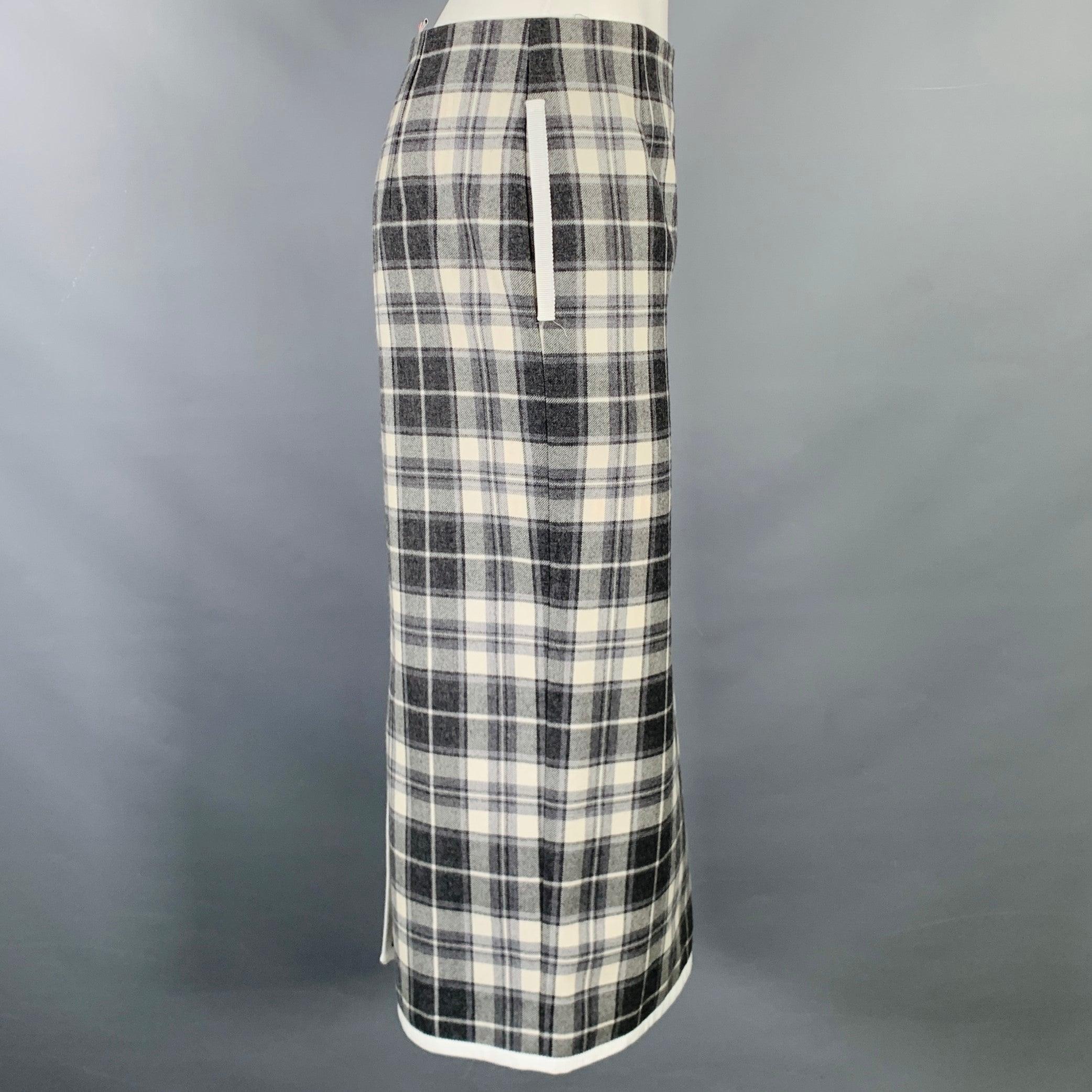 THOM BROWNE skirt
in a
grey and cream wool fabric featuring a plaid pattern, pencil style, mid-calf length, and side zipper closure. Made in Italy.Excellent Pre-Owned Condition. 

Marked:   36 

Measurements: 
  Waist: 29 inches Hip: 36 inches
