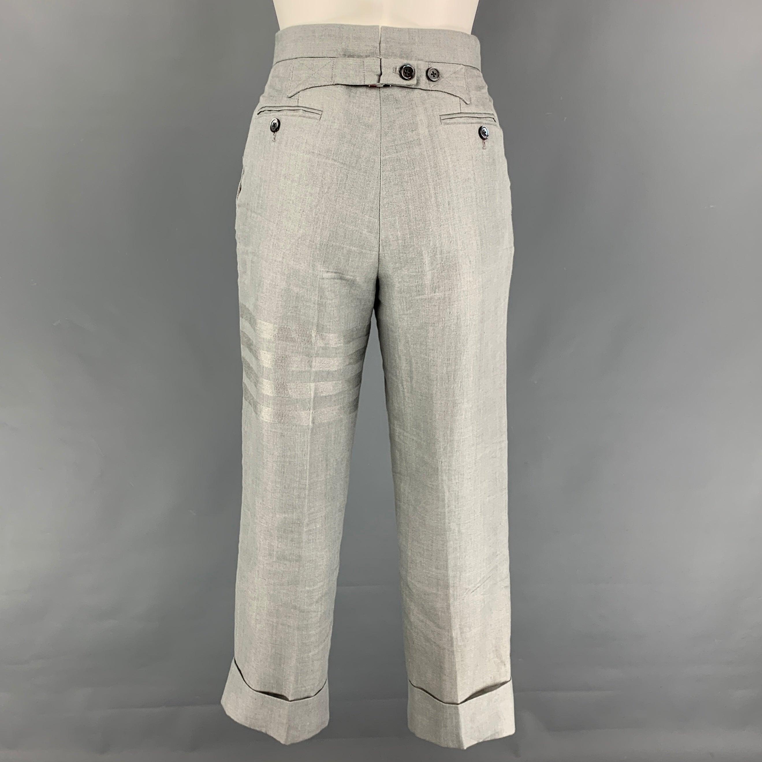 THOM BROWNE casual pants comes in a light gray linen featuring a high waist, cuffed leg, pleated, front tab, and a button fly closure. Made in Italy. Very Good
Pre-Owned Condition. 

Marked:   36 

Measurements: 
  Waist: 28 inches  Rise: 11 inches 