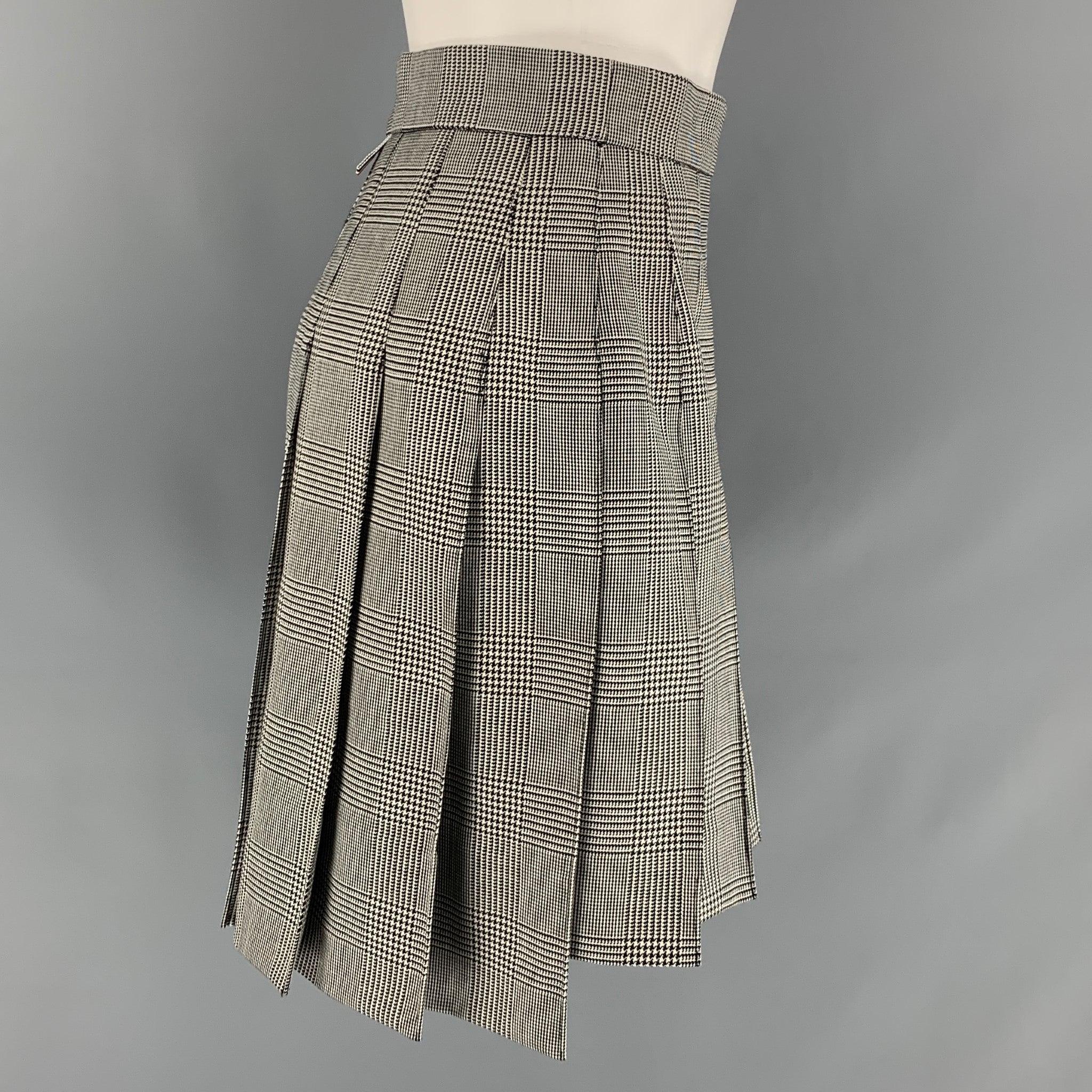 THOM BROWNE skirt comes in a black and white stripe wool featuring a pleated style, signature stripe trim, and a side zipper closure. Made in Italy. Excellent Pre-Owned Condition. 

Marked:   38 

Measurements: 
  Waist: 27 inches Hip: 36 inches